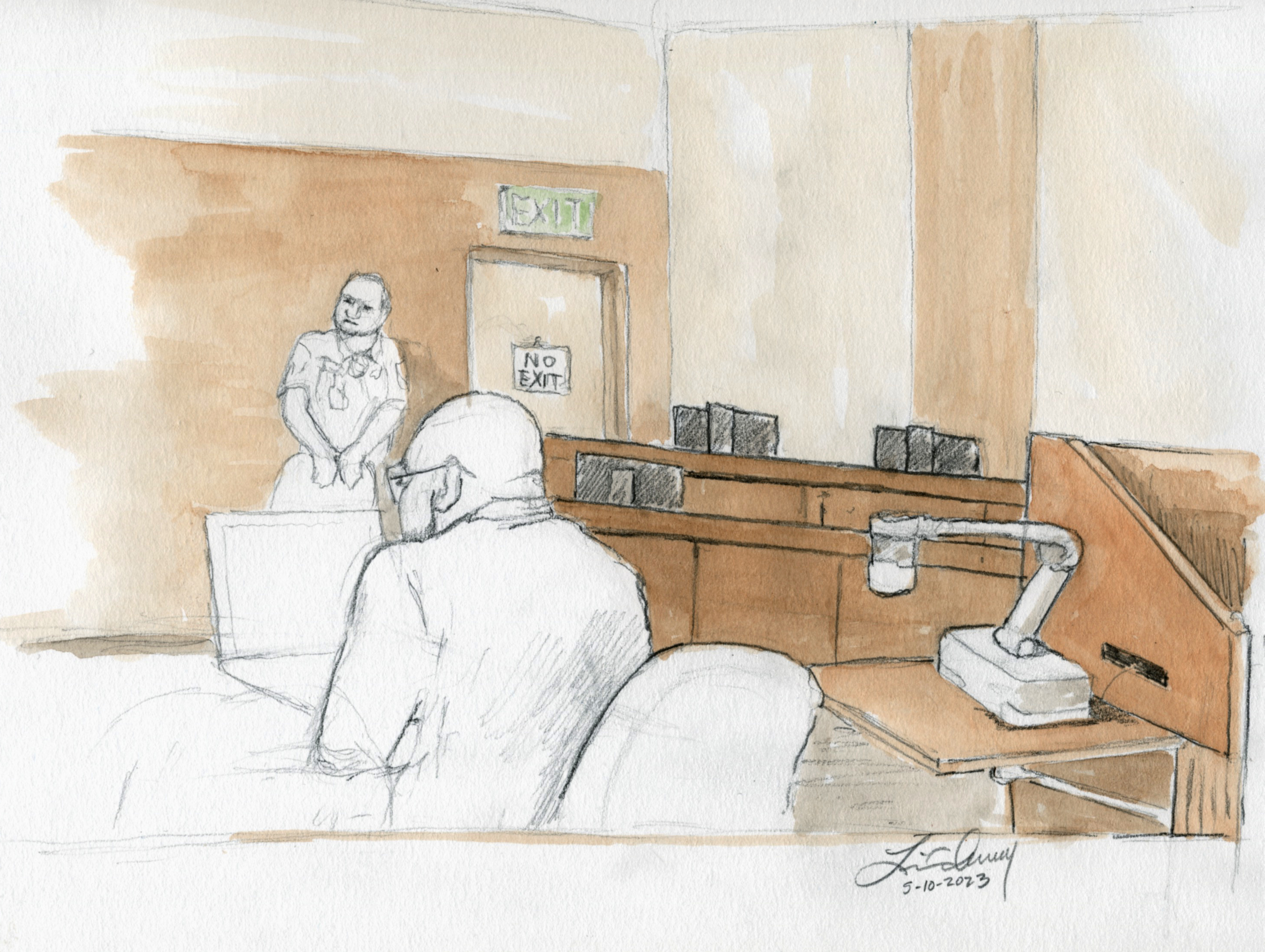 Prosecutor Rob Wood and a bailiff are in front of a empty jury box during the trial for Lori Vallow Daybell on Wednesday.