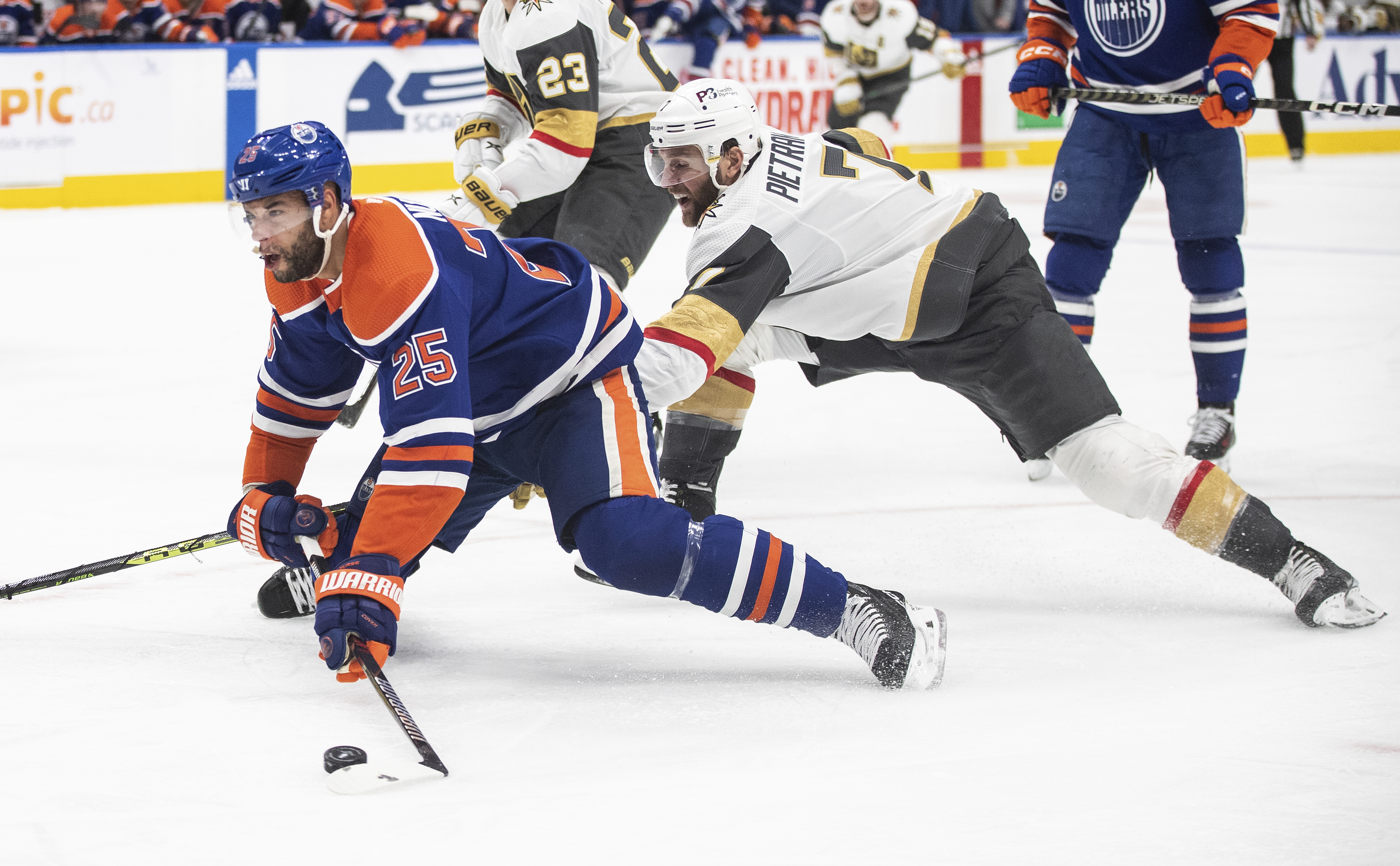 Vegas Golden Knights' Alex Pietrangelo (7) trips Edmonton Oilers' Darnell Nurse (25) during the second period of Game 4 of an NHL hockey second-round playoff series Wednesday, May 10, 2023, in Edmonton, Alberta. 