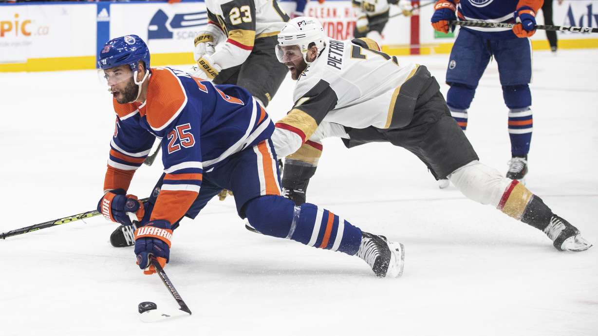 Vegas Golden Knights' Alex Pietrangelo (7) trips Edmonton Oilers' Darnell Nurse (25) during the second period of Game 4 of an NHL hockey second-round playoff series Wednesday, May 10, 2023, in Edmonton, Alberta.