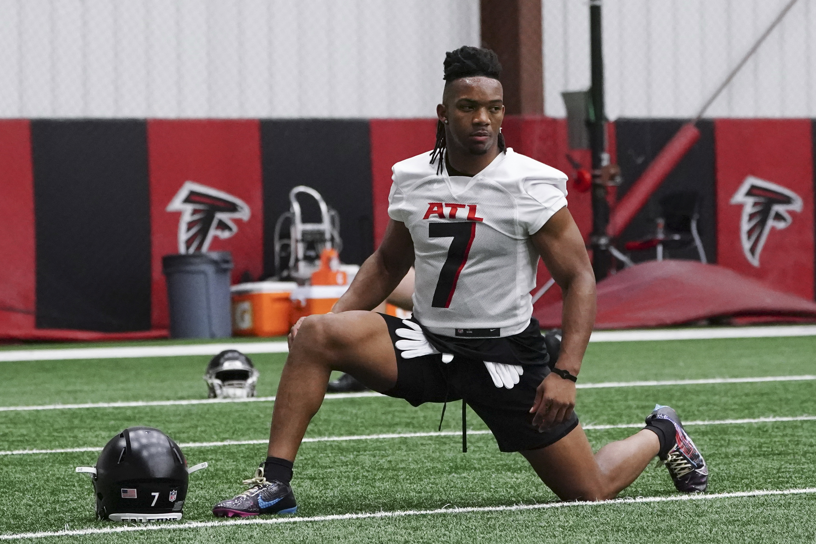 Atlanta Falcons rookie running back Bijan Robinson (7) stretches during the NFL football team's rookie minicamp Friday, May 12, 2023, in Flowery Branch, Ga. 
