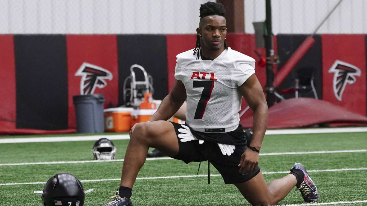 Atlanta Falcons rookie running back Bijan Robinson (7) stretches during the NFL football team's rookie minicamp Friday, May 12, 2023, in Flowery Branch, Ga.