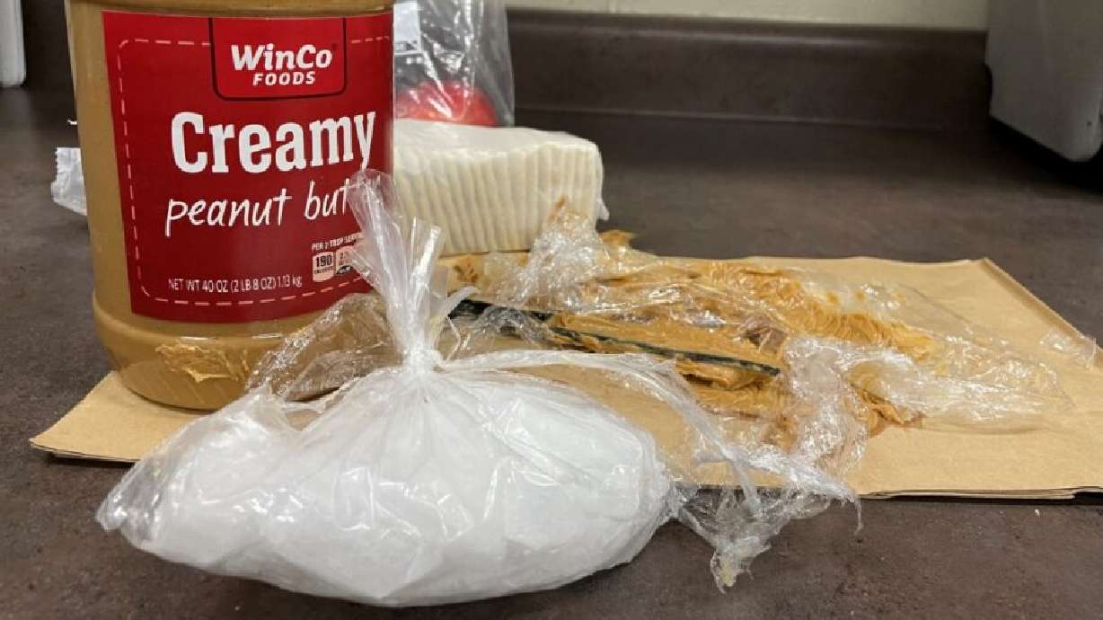 A photo of a peanut butter jar with a bag, contain meth, sits on a police evidence shelf on Thursday. TSA agents found over a half pound of what police think is crystal meth hidden in a jar of peanut butter Thursday morning at the Salt Lake International Airport.
