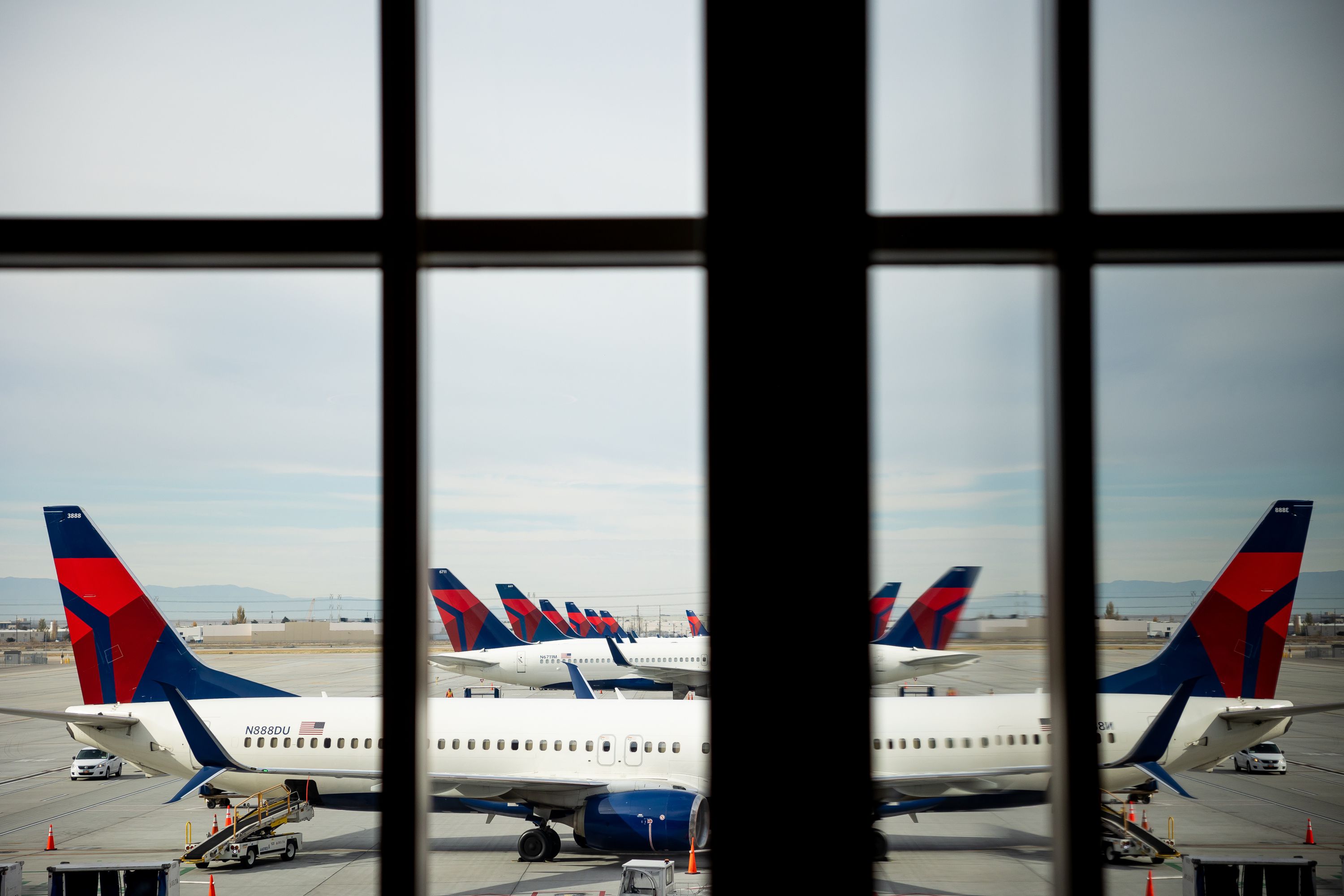 Delta Air Lines aircraft lined up at Salt Lake City International Airport on Nov. 18, 2021. Utah Rep. Burgess Owens and Georgia Rep. Hank Johnson introduced a bill that would allow more flights to land at Ronald Reagan Washington National Airport.