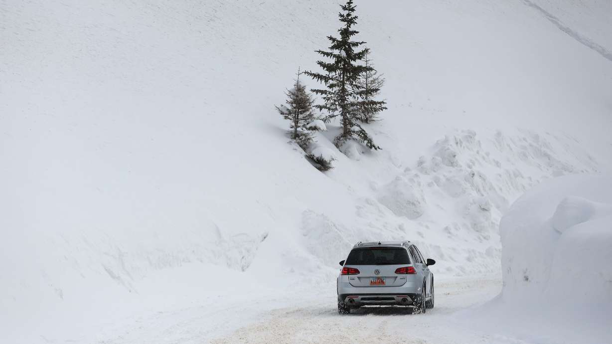 A motorist drives into Solitude Ski Resort on Wednesday. Keeping roads cleared this past winter was costly for Utah roads crews.