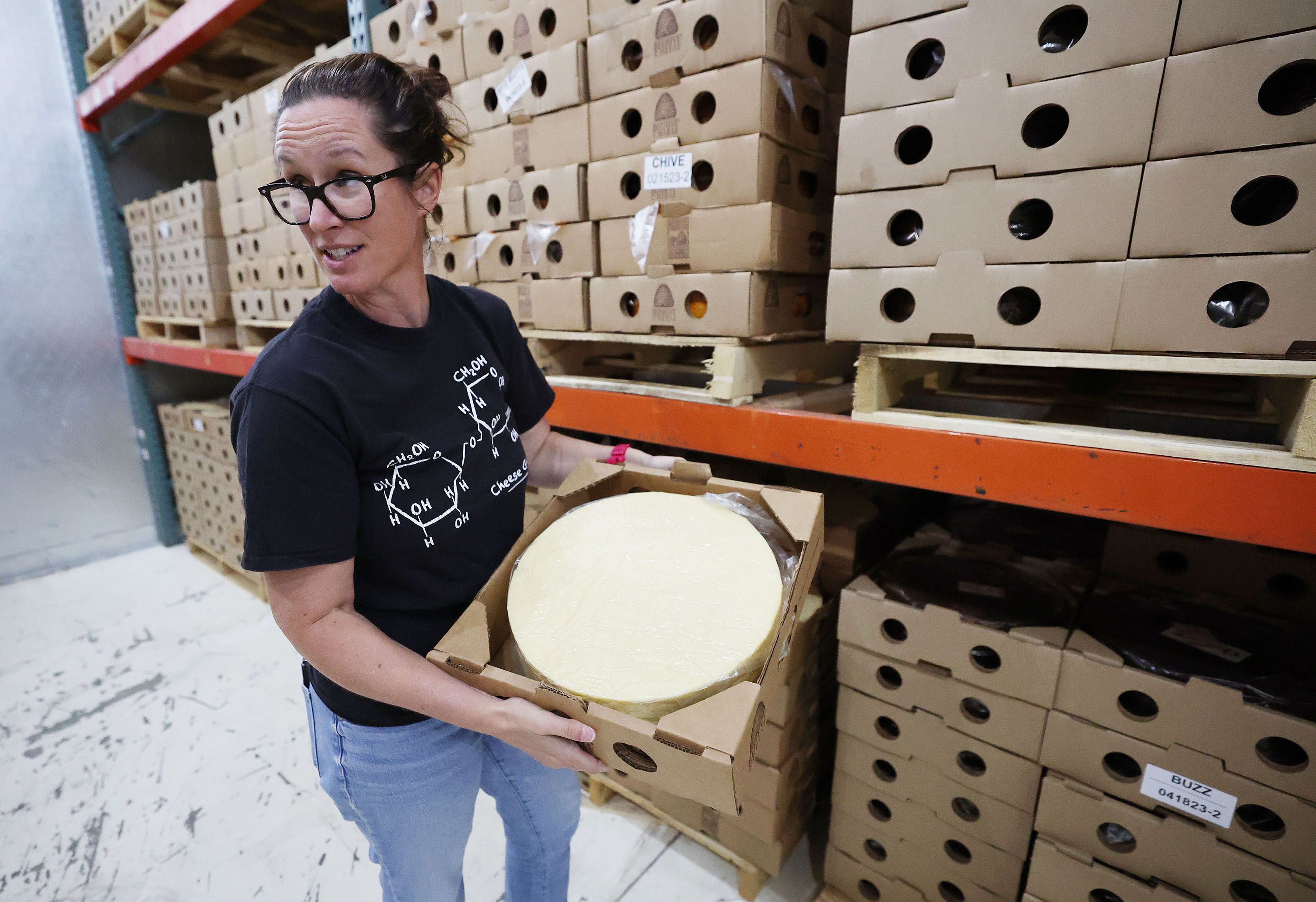 Katie Schall talks about the aging process of cheese at Beehive Cheese, a second generation family-owned business, in Uintah, Weber County, on May 2.