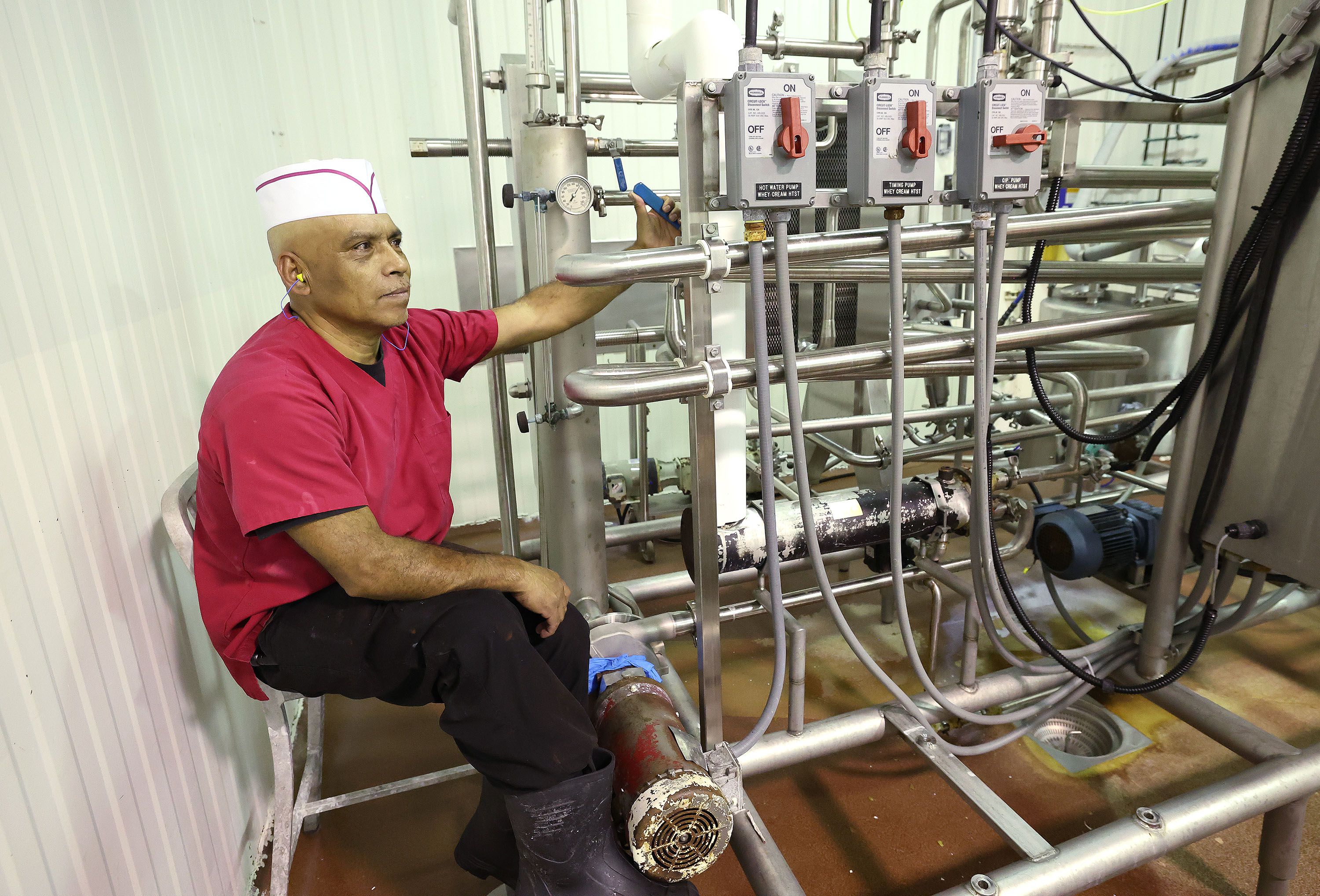 Eulugio Martinon works with milk pasteurization at Beehive Cheese, a second generation family-owned business, in Uintah, Weber County, on May 2.