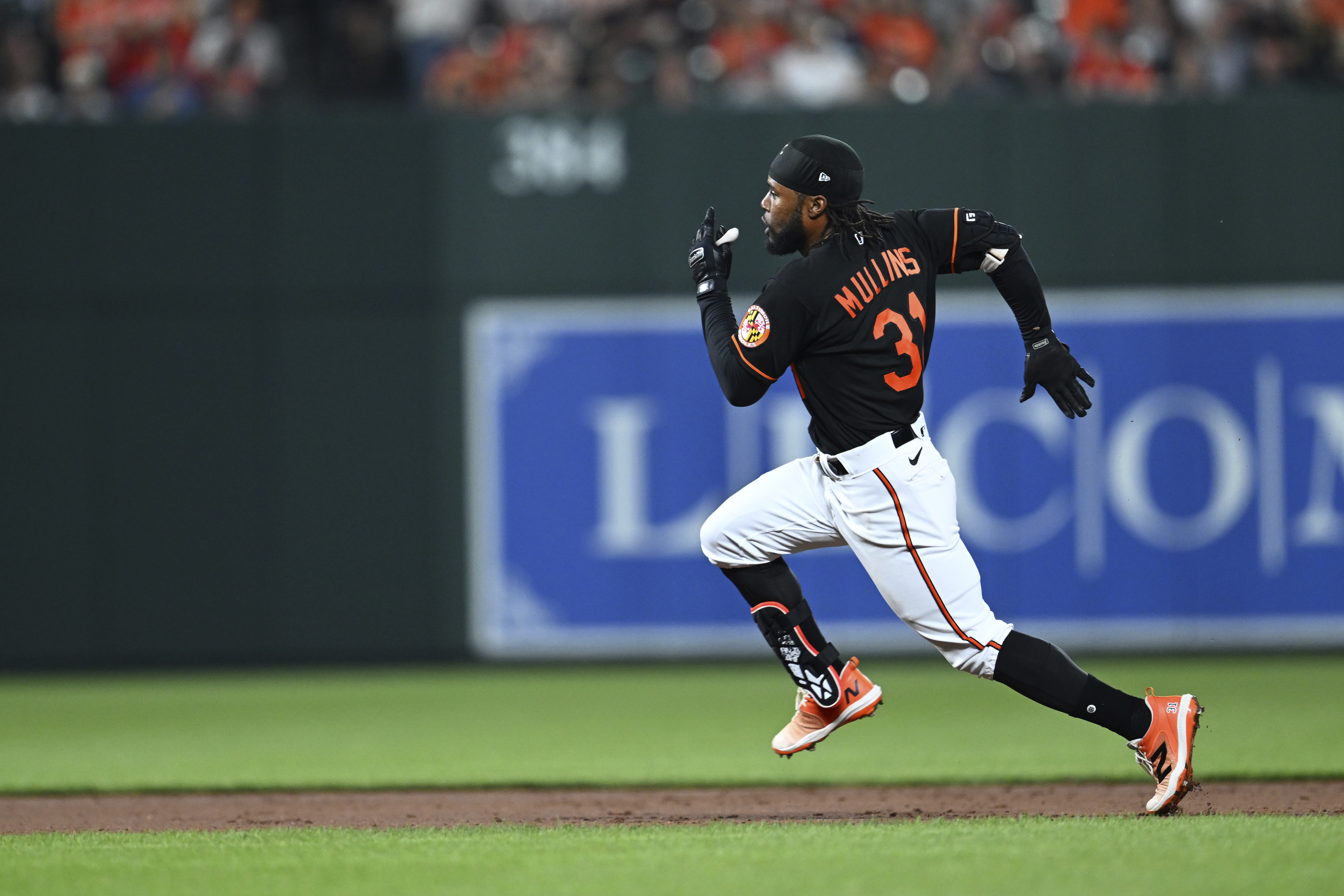 Baltimore Orioles' Cedric Mullins races to third on a triple against the Pittsburgh Pirates during the fifth inning of a baseball game Friday, May 12, 2023, in Baltimore.