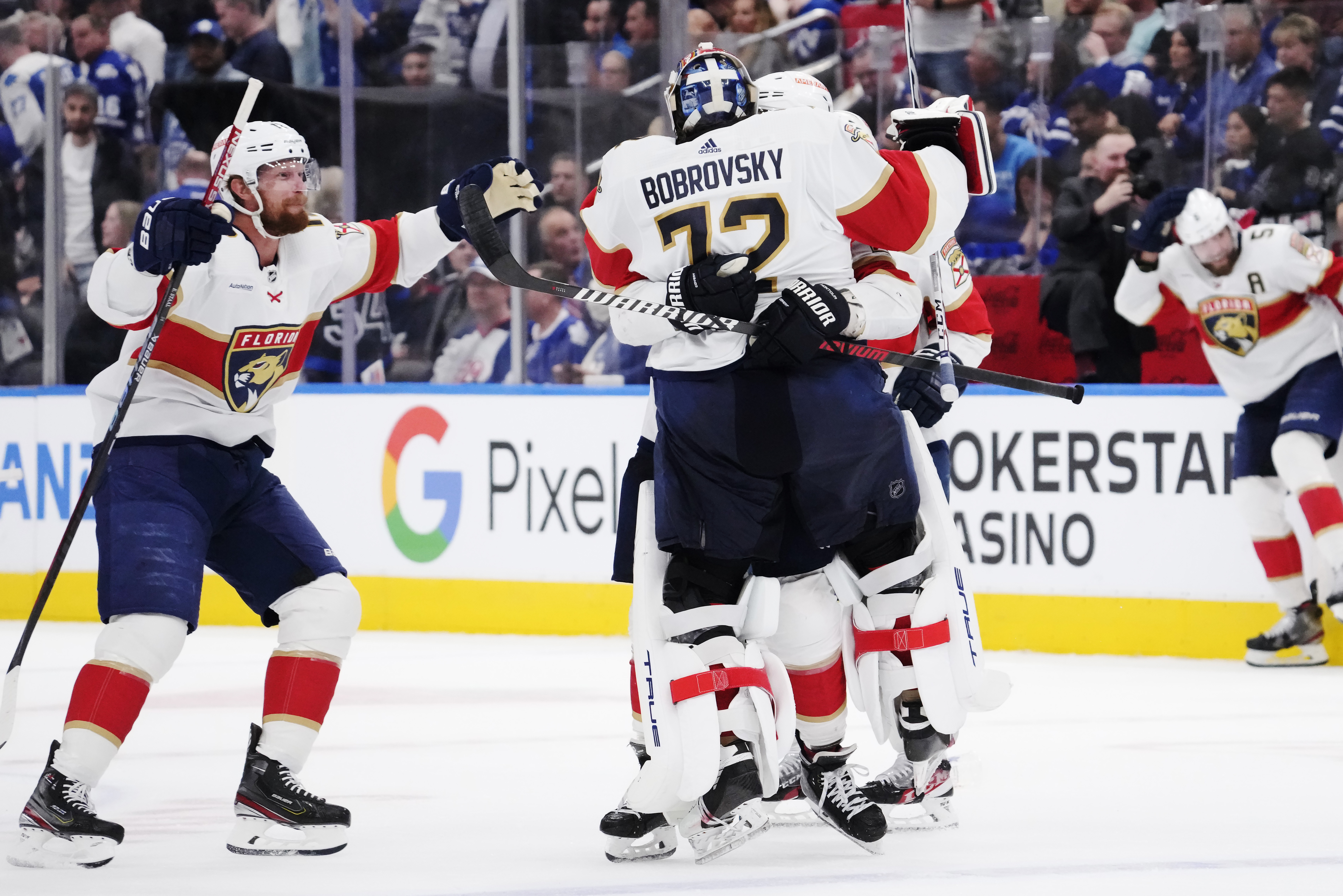Florida Panthers goaltender Sergei Bobrovsky (72) celebrates with teammates after defeating the Toronto Maple Leafs in overtime of an NHL hockey Stanley Cup second-round playoff series Friday, May 12, 2023, in Toronto. 