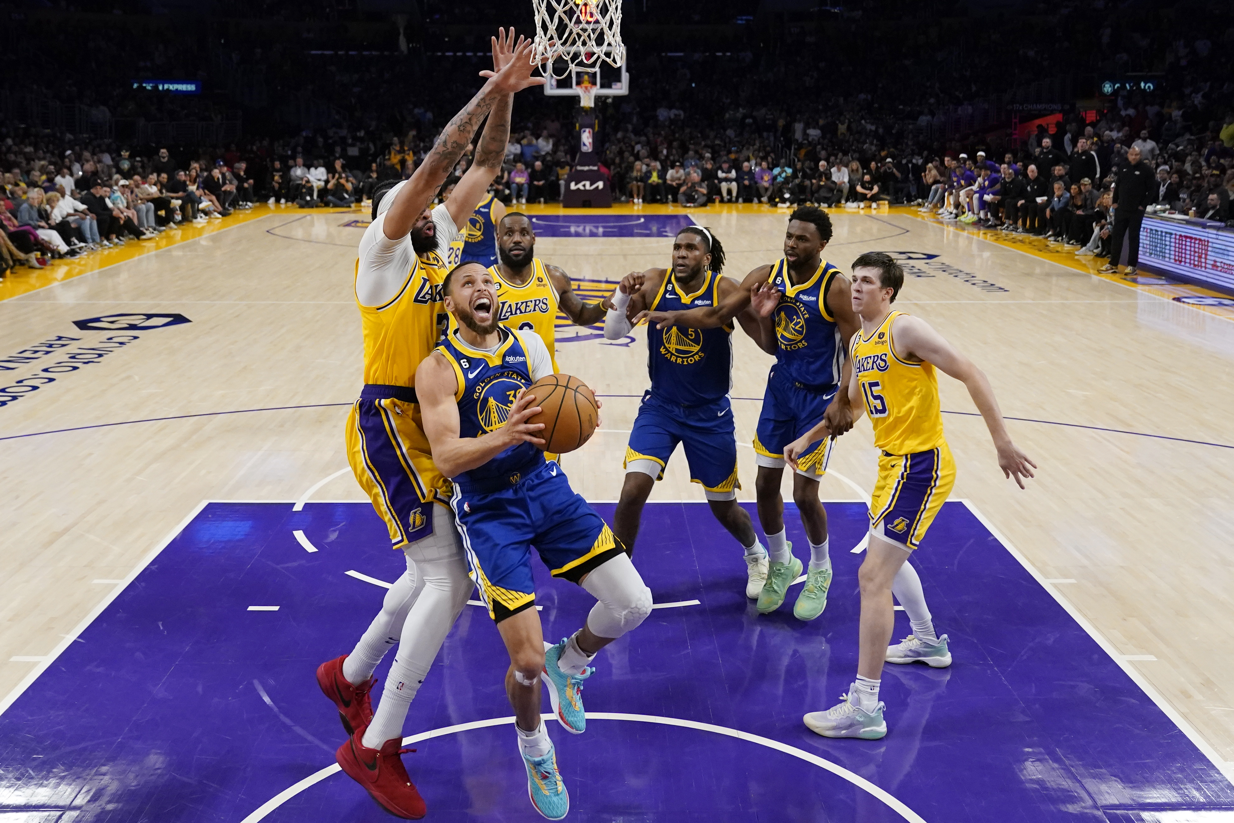 Golden State Warriors guard Stephen Curry (30) drives to the basket against the Los Angeles Lakers during the second half in Game 6 of an NBA basketball Western Conference semifinal series Friday, May 12, 2023, in Los Angeles. 