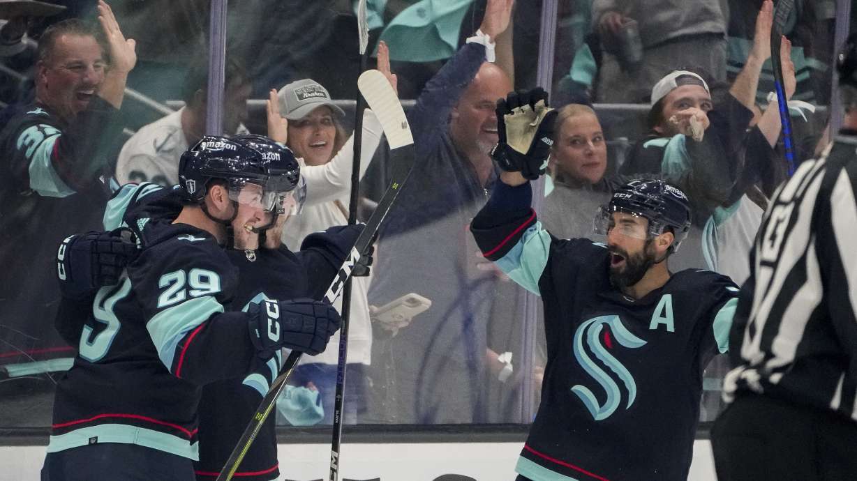 Seattle Kraken defenseman Vince Dunn (29) and right wing Jordan Eberle, right, celebrate a goal by left wing Tye Kartye, center, against the Dallas Stars during the second period of Game 6 of an NHL hockey Stanley Cup second-round playoff series Saturday, May 13, 2023, in Seattle.