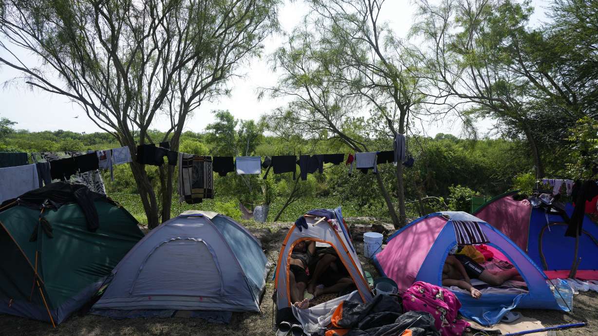 Venezuelan migrants rest inside their tents on the bank of the Rio Grande in Matamoros, Mexico, Sunday. Migrants are adapting to new asylum rules and legal pathways meant to discourage illegal crossings.