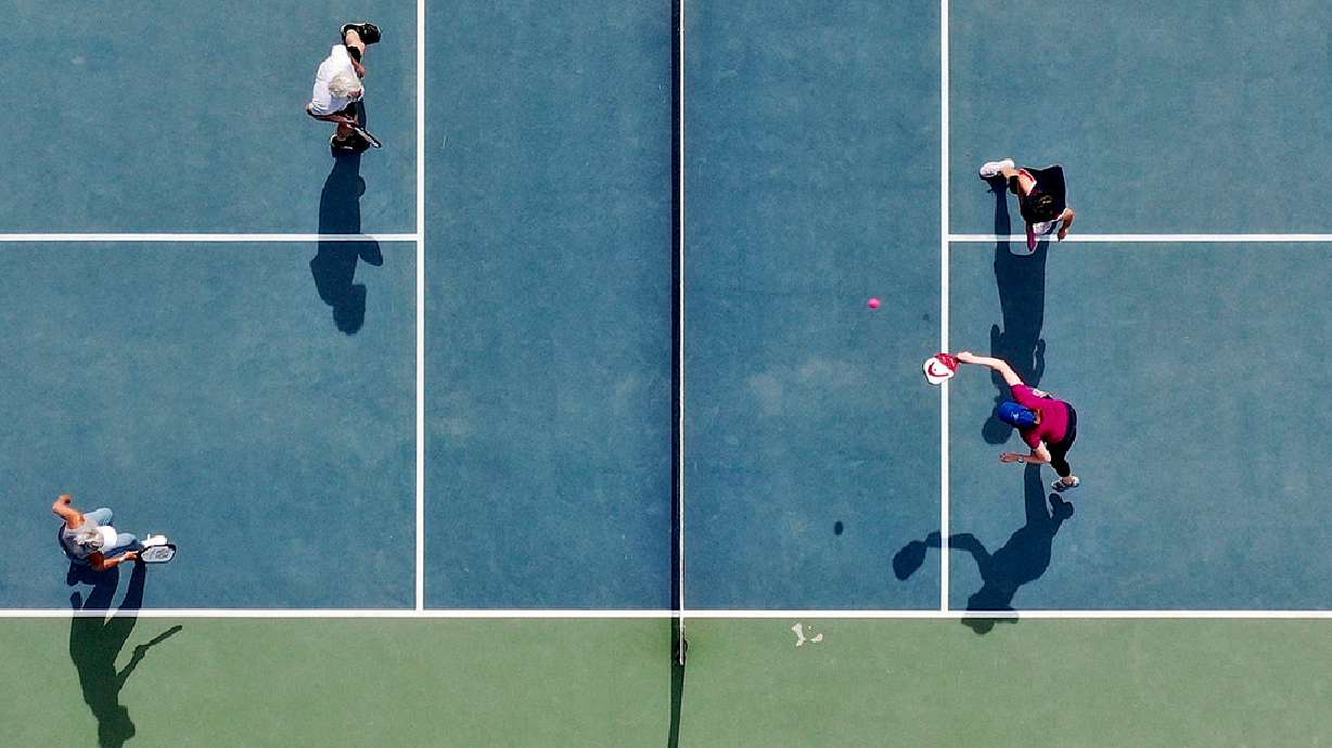 People play pickleball at 11th Avenue Park in Salt Lake City. A plan to bring an indoor pickleball facility to Park City is on hold after officials said they couldn't reach a deal that the city council would approve.
