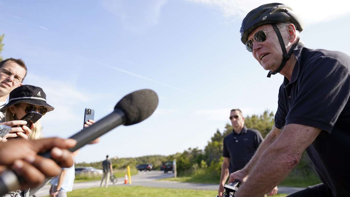 President Joe Biden speaks to the media in Gordons Pond State Park in Rehoboth Beach, Del., Sunday. Biden says he and congressional leaders will likely resume talks on Tuesday at the White House over the debt limit.