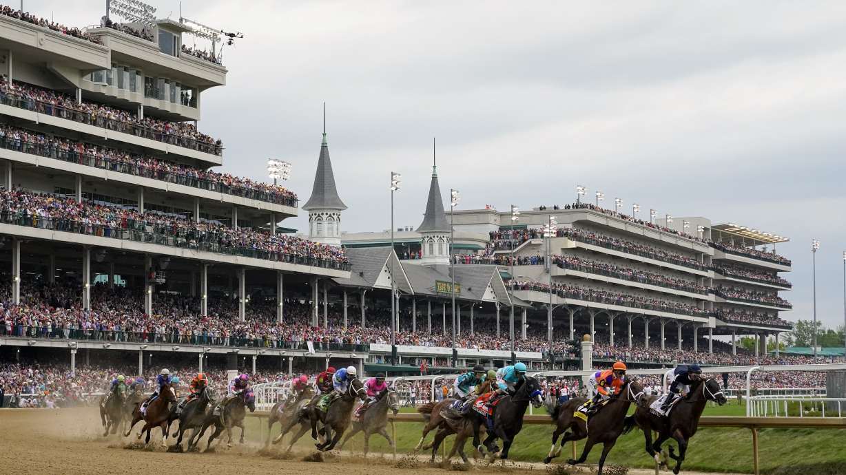 Horses come through the first turn during the 149th running of the Kentucky Derby horse race at Churchill Downs Saturday, May 6, 2023, in Louisville, Ky.