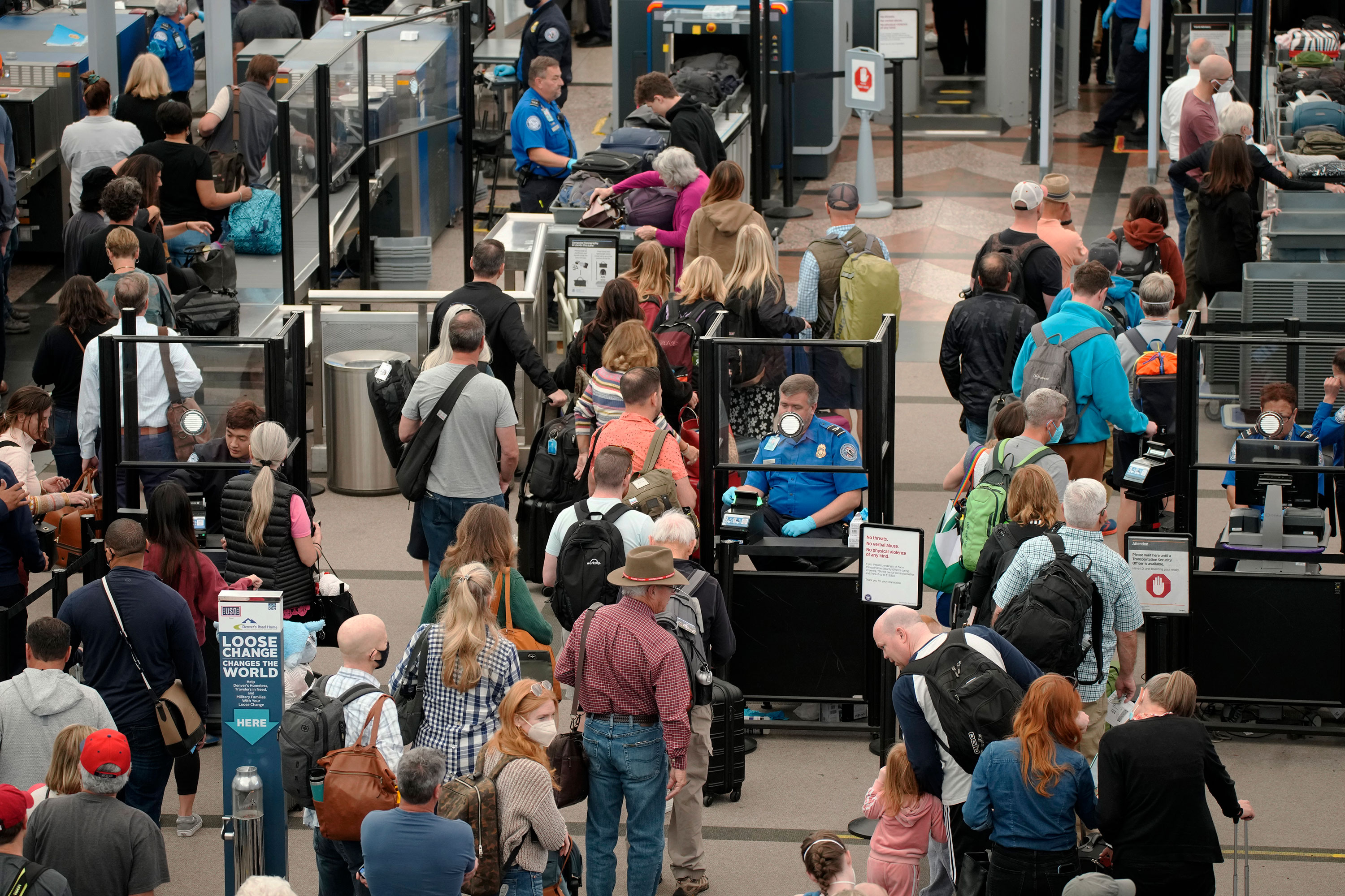 Pictured are travelers at Denver International Airport in 2022. AAA says this Memorial Day weekend could be the busiest at airports since 2005. 