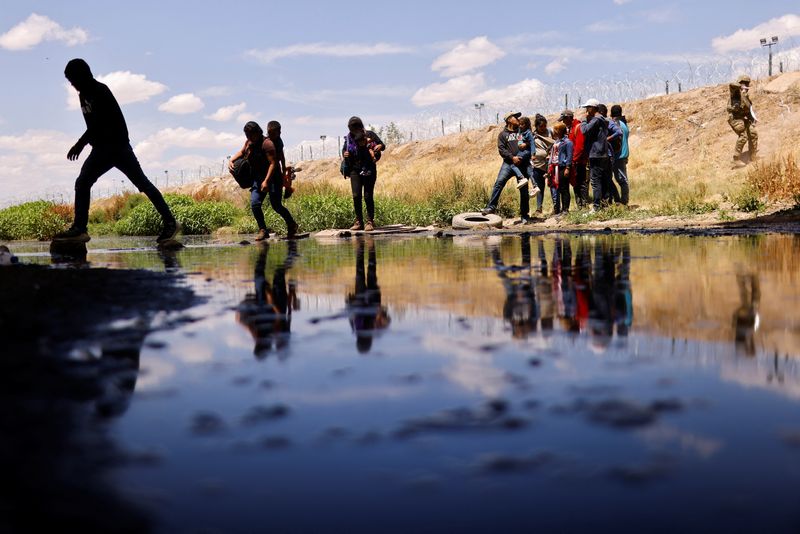Migrants cross the Rio Bravo river to return to Mexico as seen from Ciudad Juarez, Mexico, Saturday. U.S. officials said there will be "tougher consequences" for migrants illegally crossing the Mexico border.