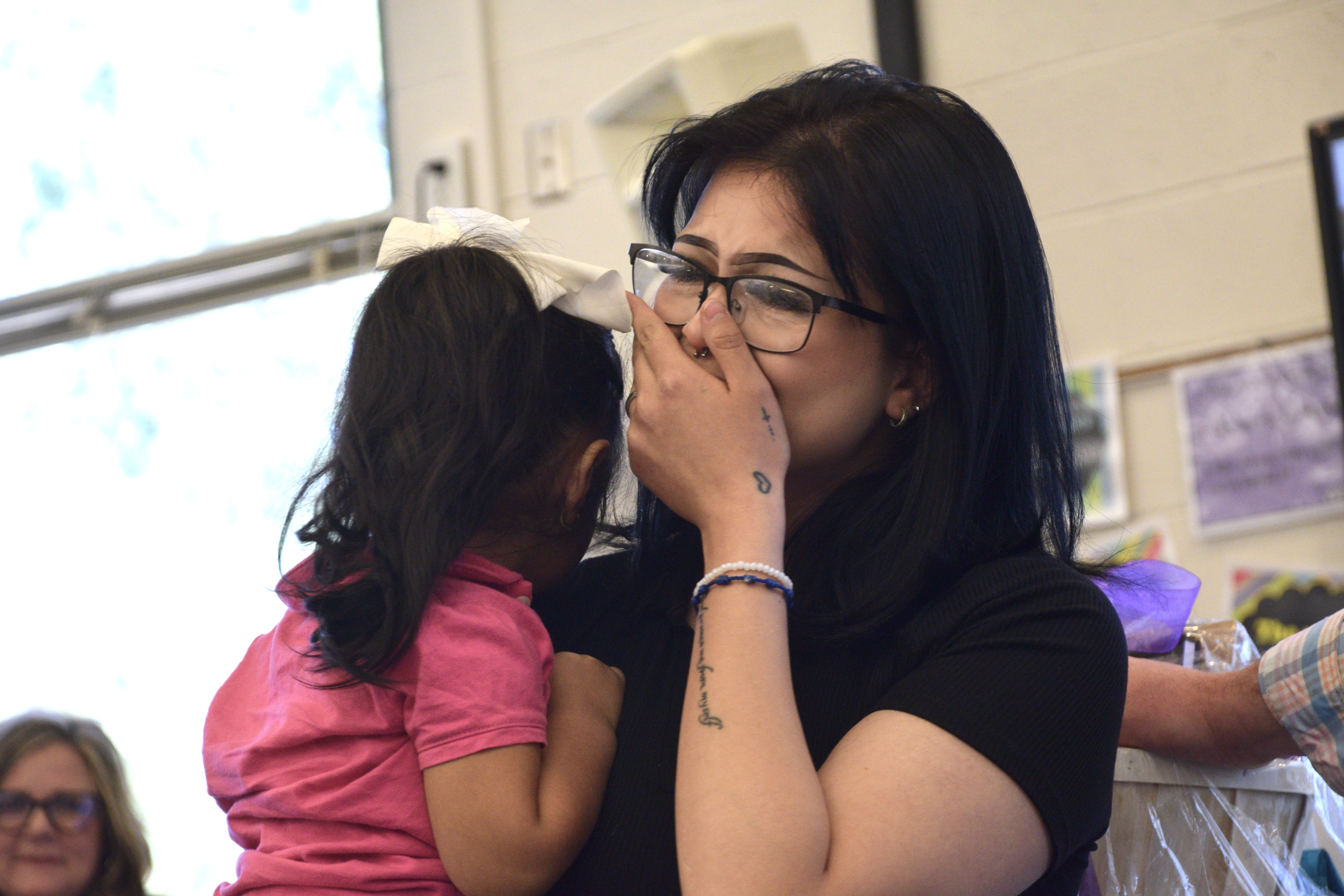 Angie Gonzalez, a senior at Granite Connection High School, gets emotional after being awarded $1,000 in scholarship money during a ceremony Monday where she was recognized as Granite School District's Absolutely Incredible Kid.