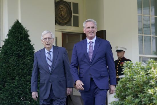 House Speaker Kevin McCarthy of Calif., right, and Senate Minority Leader Mitch McConnell of Ky., left, walk out of the West Wing of the White House in Washington, to speak to reporters May 9, following a meeting with President Joe Biden on the debt limit.