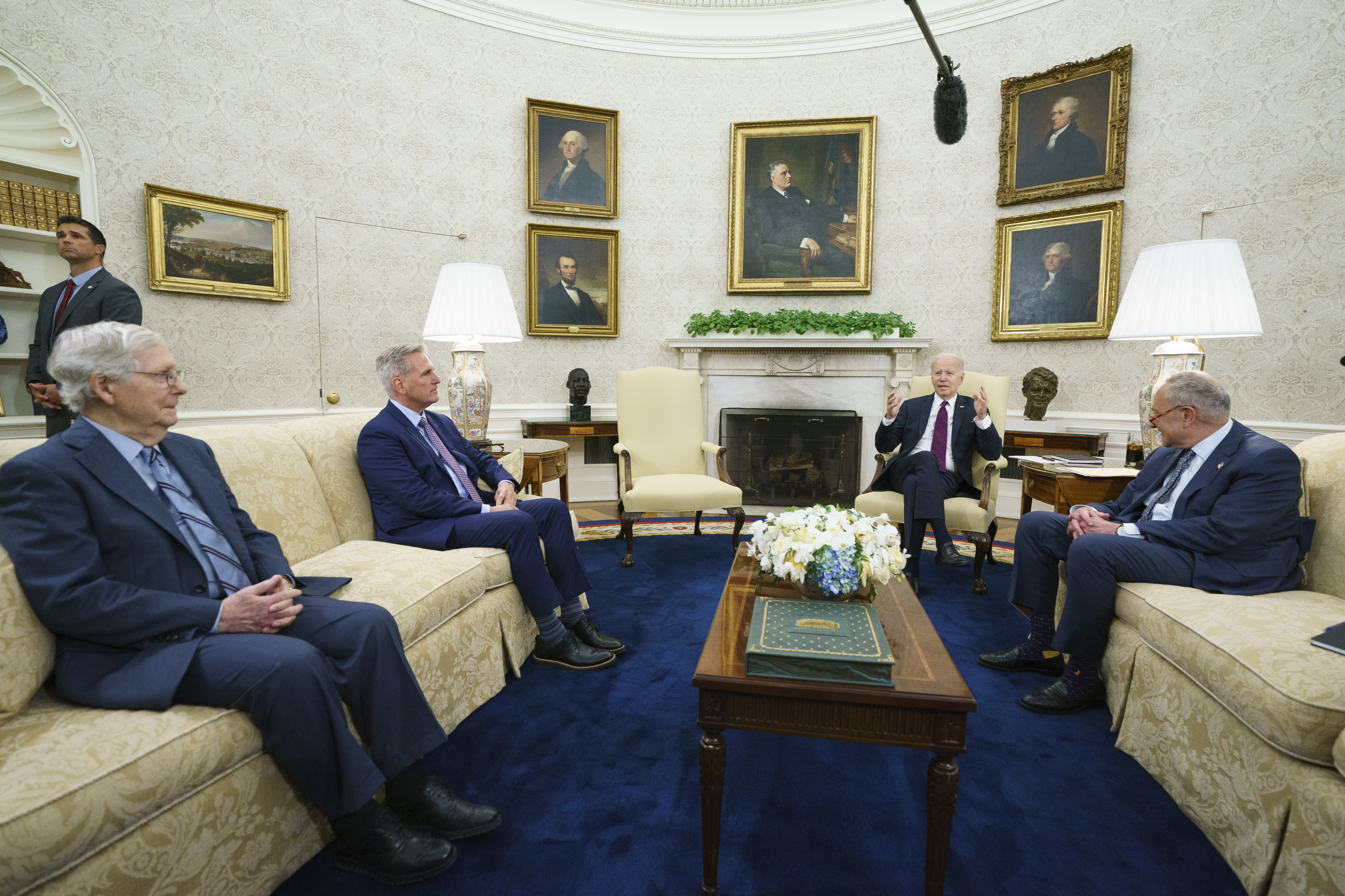 Senate Minority Leader Mitch McConnell of Ky., Speaker of the House Kevin McCarthy of Calif., and Senate Majority Leader Sen. Chuck Schumer of N.Y., listen as President Joe Biden speaks before a meeting to discuss the debt limit in the Oval Office of the White House, May 9, in Washington.