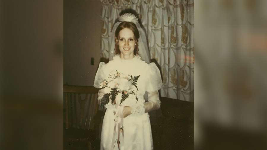 Nancy Perry poses in her wedding dress circa April 1970.