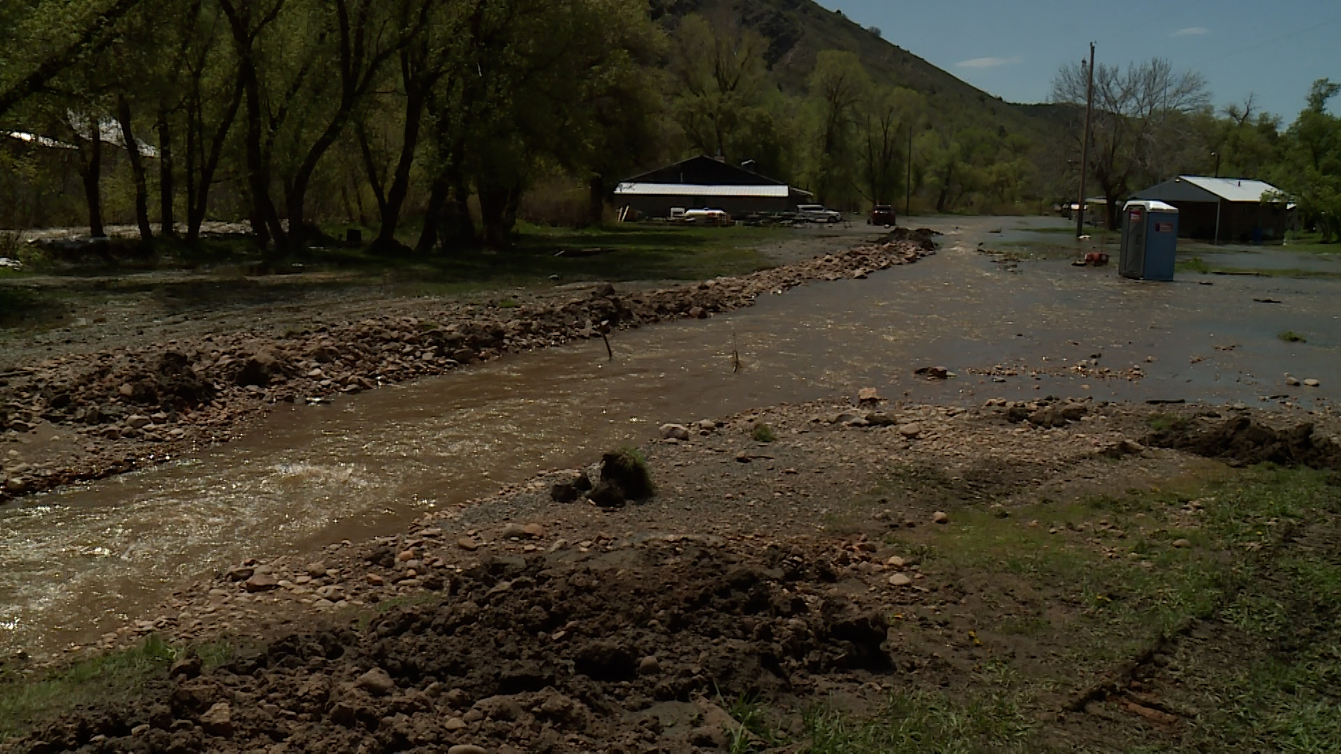 The South Fork Ogden River continues to spill over its banks, threatening homes and property. That's why the community was out Monday working together to redirect those waters and minimize the damage.