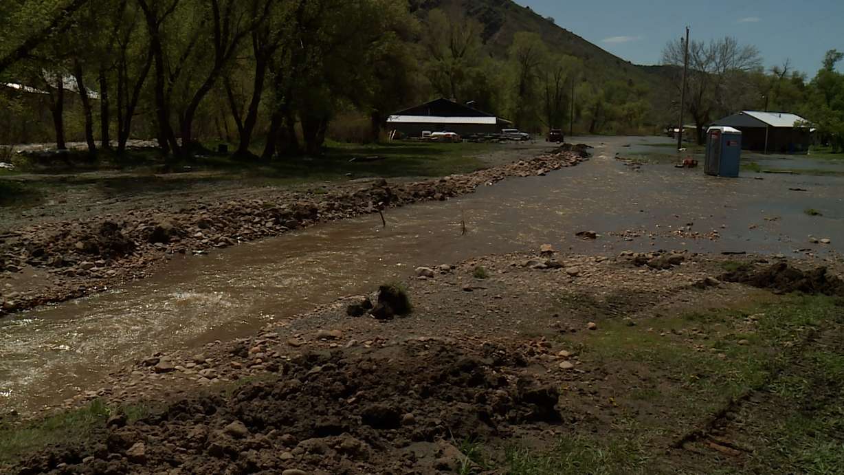 The South Fork Ogden River continues to spill over its banks, threatening homes and property. That's why the community was out Monday working together to redirect those waters and minimize the damage.