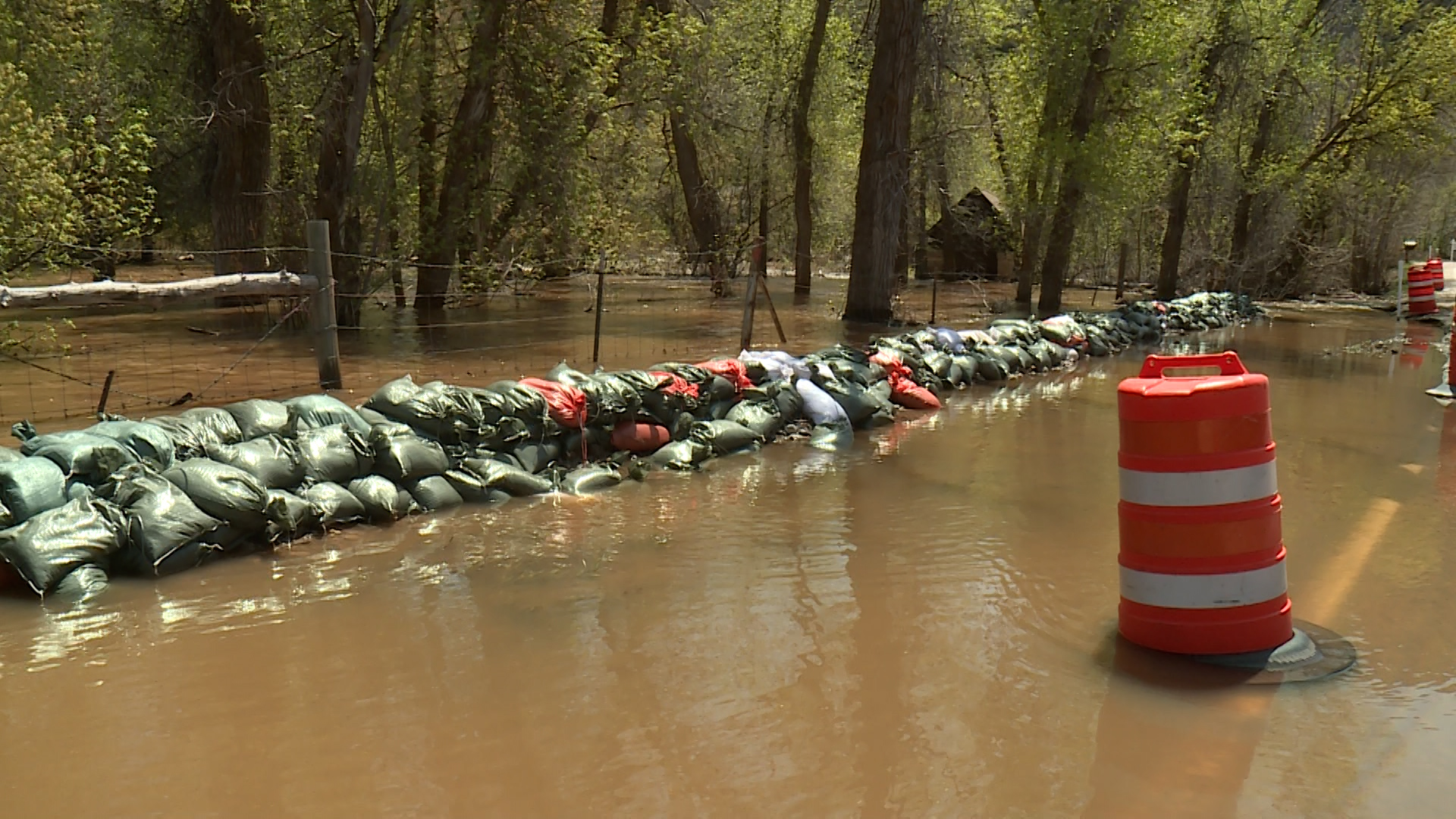 The South Fork Ogden River continues to spill over its banks, threatening homes and property. That's why the community was out Monday working together to redirect those waters and minimize the damage.