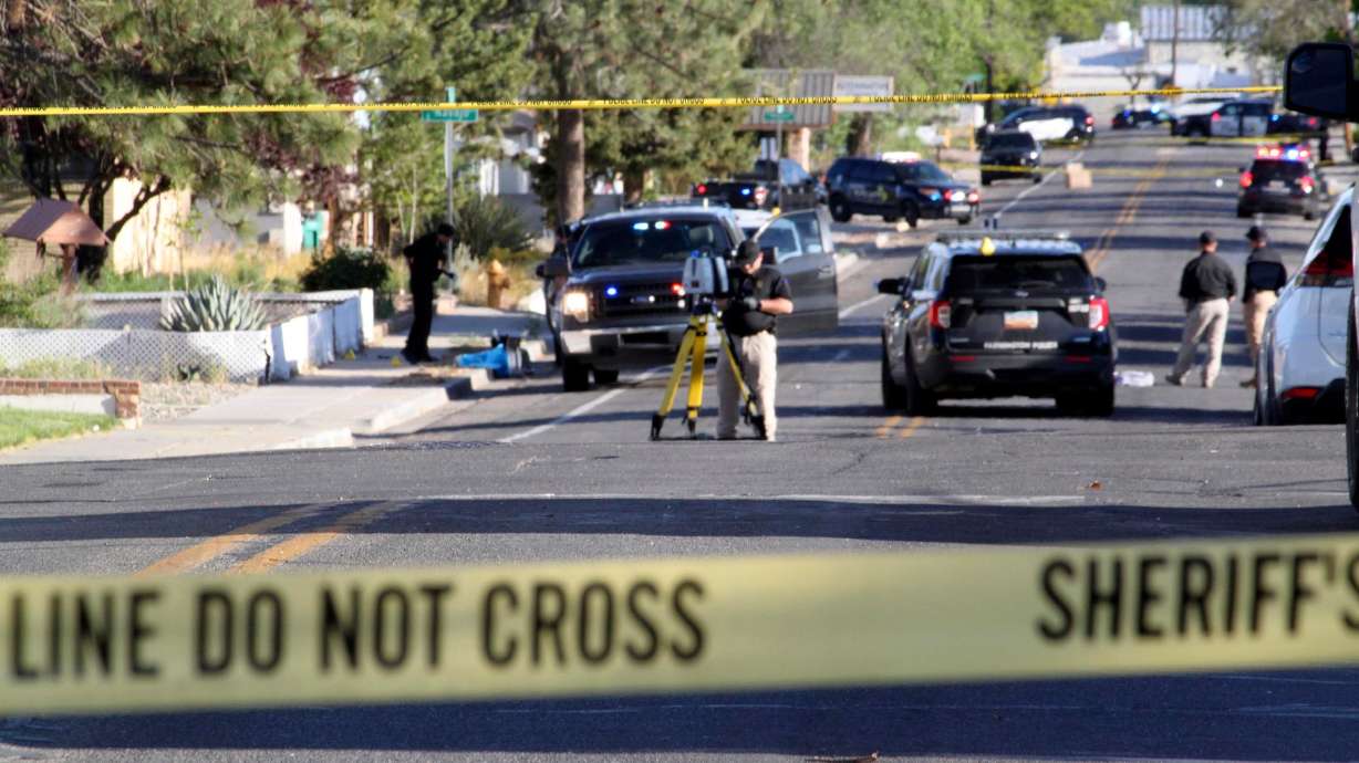 Investigators in Farmington, New Mexico, work Monday on a residential street after the shooting. Authorities on Tuesday identified Beau Wilson, 18, as the gunman who killed three people and wounded six others Monday.