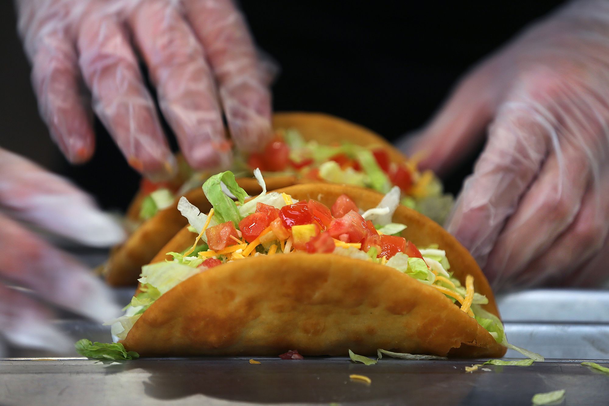 Tacos are made to order at the Taco Bell Cantina in Brookline, MA, in 2020.