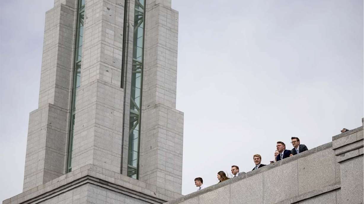 People stand on an upper floor of the Conference Center after the Saturday morning session of the 193rd Annual General Conference of The Church of Jesus Christ of Latter-day Saints in Salt Lake City on April 1.