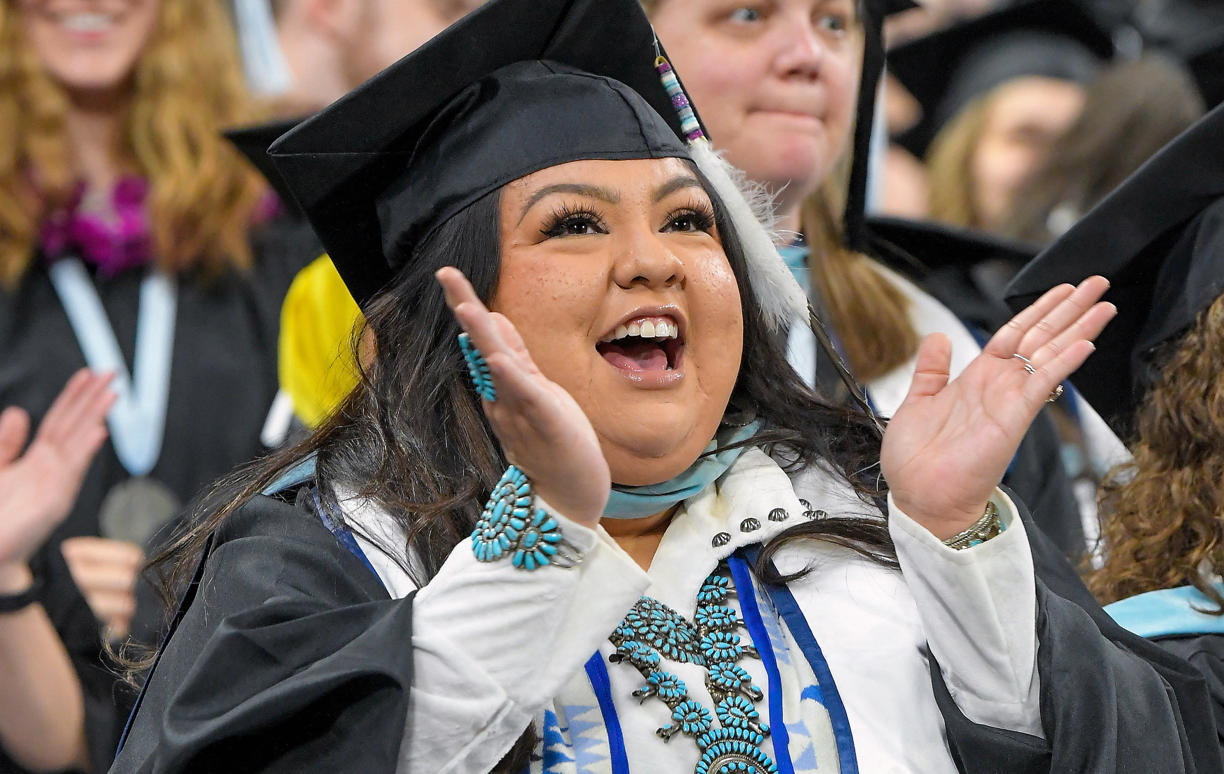 Alina Begay, of the Navajo Nation, celebrates during Utah State University’s commencement ceremony on May 4, in Logan. The university recently announced a new scholarship for Native American students.