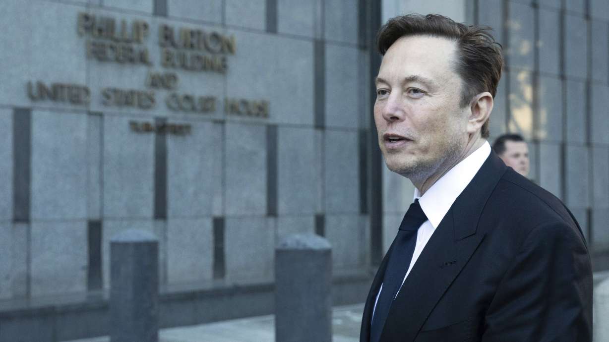 Elon Musk departs court in San Francisco, Jan. 24. Lawyers for Tesla are asking a federal appeals court to reconsider its ruling that Musk unlawfully threatened employees with a loss of stock options in a 2018 Twitter post amid a union organizing effort.