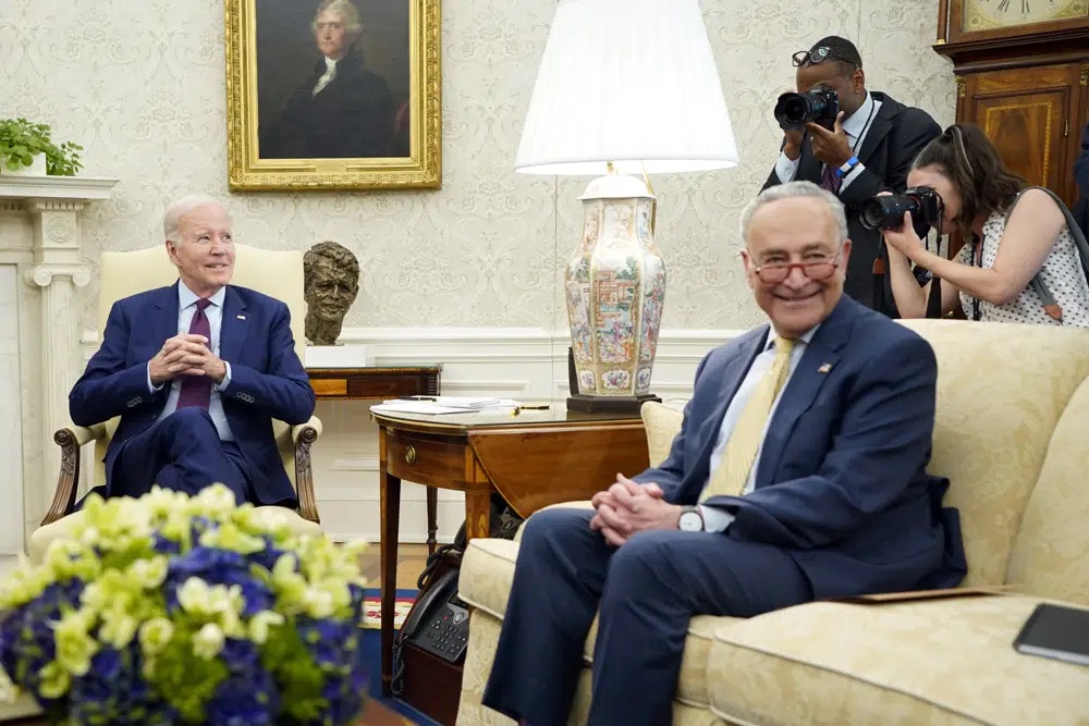 President Joe Biden and Senate Majority Leader Chuck Schumer of N.Y., meeting with Congressional leaders in the Oval Office of the White House, Tuesday, in Washington.
