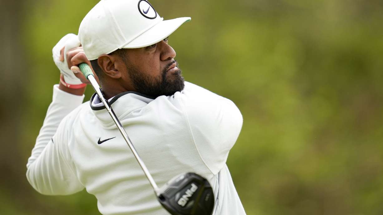 Tony Finau watches his tee shot on the 17th hole during a practice around for the PGA Championship golf tournament at Oak Hill Country Club on Tuesday, May 16, 2023, in Rochester, N.Y.