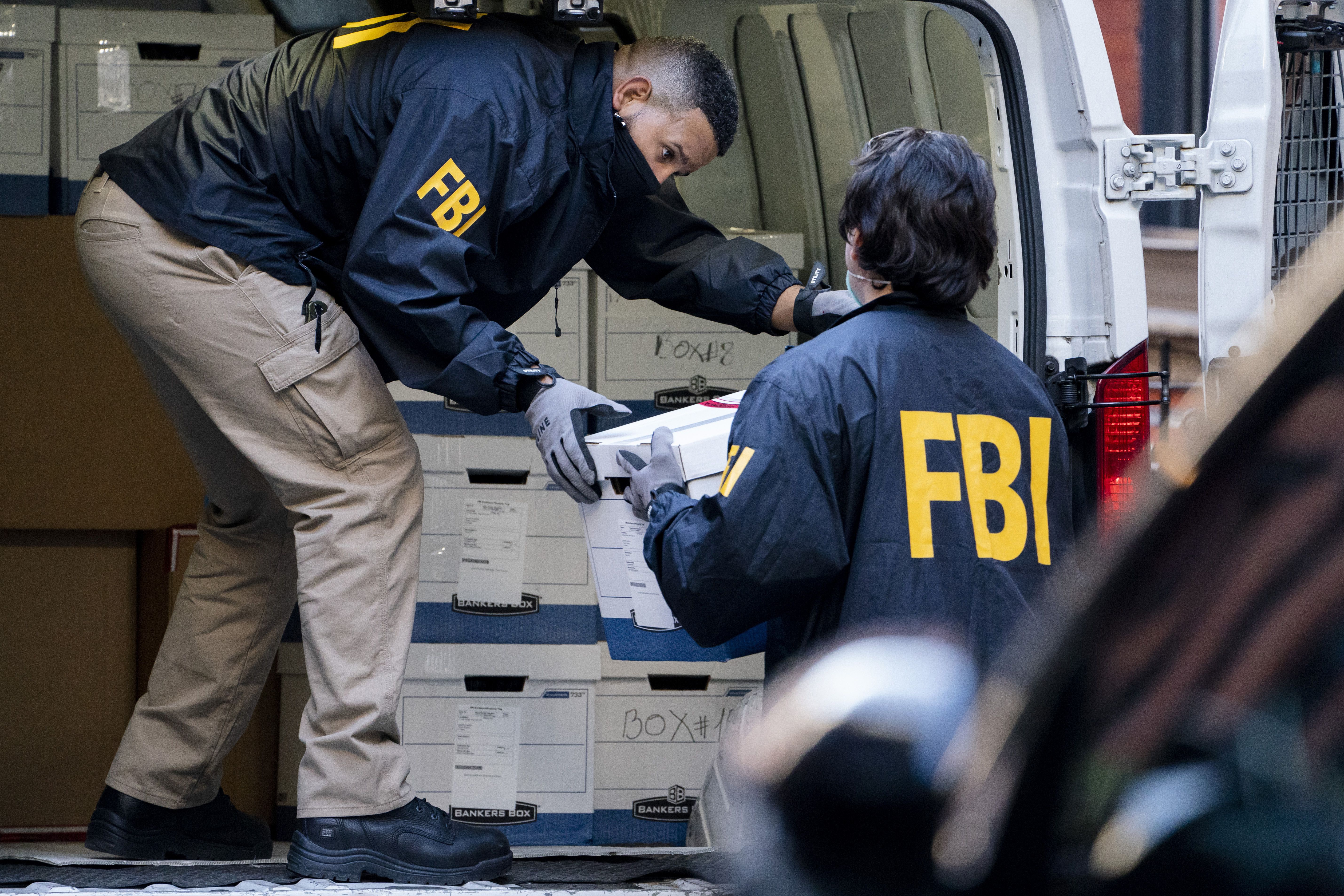 Federal agents load a vehicle with evidence boxes taken from a property related to Russian oligarch Oleg Deripaska on Oct. 19, 2021, in New York. Two members of Utah's congressional delegation say change is imminent for the FBI in the wake of the Durham report.