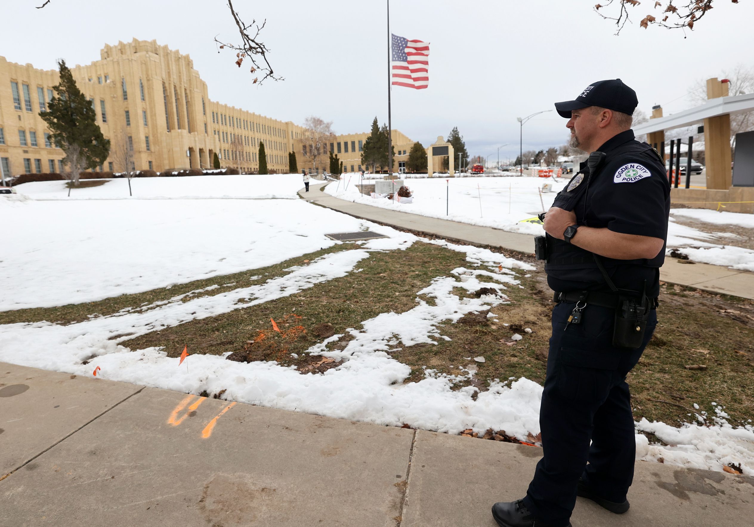 Ogden police officer Chavis Whitby stands outside of Ogden High School after false threats of shots fired on March 29. Lawmakers discussed the hoax on Tuesday. 