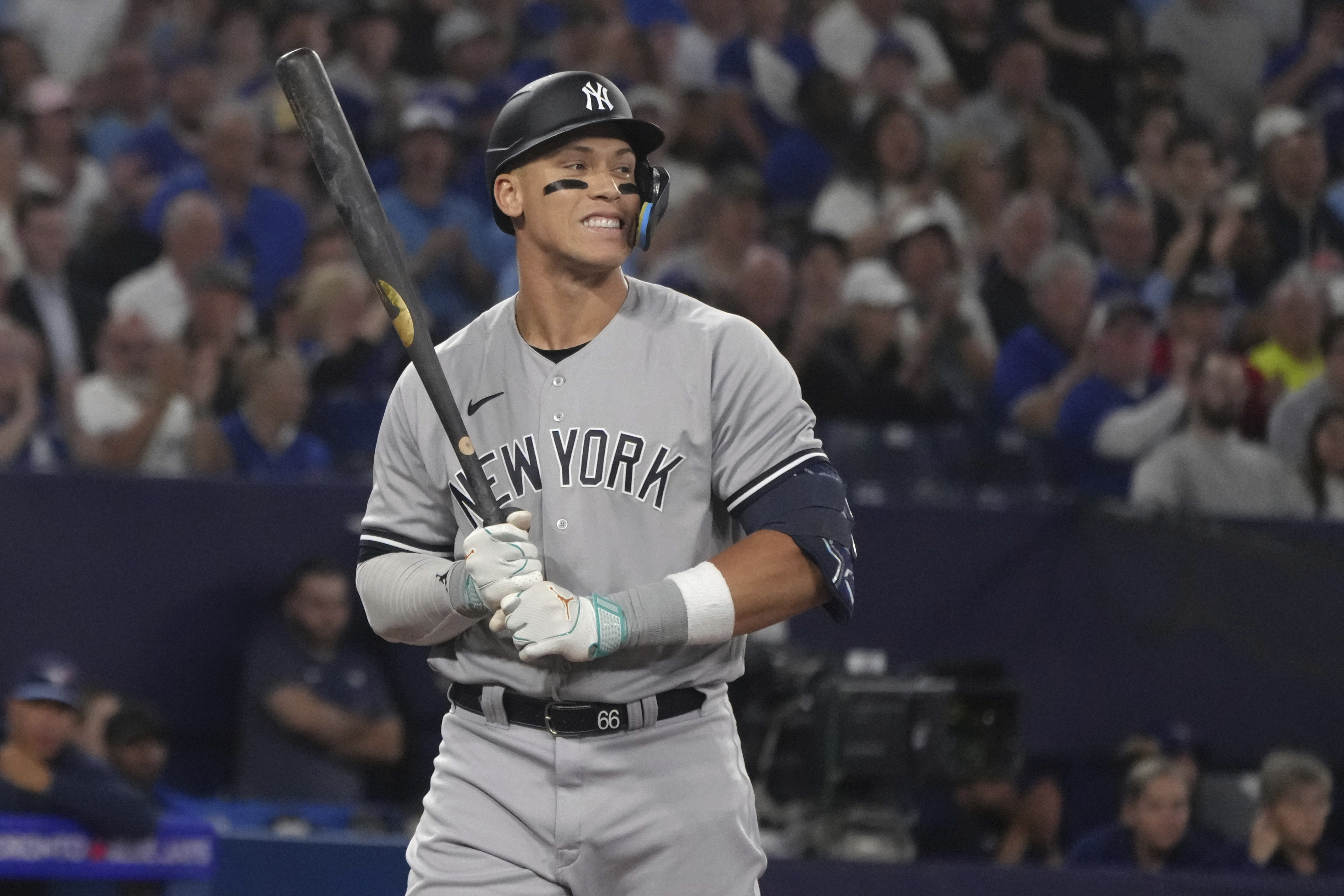 New York Yankees' Aaron Judge reacts after striking out against Toronto Blue Jays starting pitcher Kevin Gausman during the fifth inning of a baseball game Tuesday, May 16, 2023, in Toronto. 