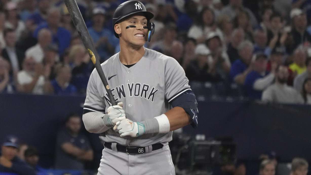 New York Yankees' Aaron Judge reacts after striking out against Toronto Blue Jays starting pitcher Kevin Gausman during the fifth inning of a baseball game Tuesday, May 16, 2023, in Toronto.