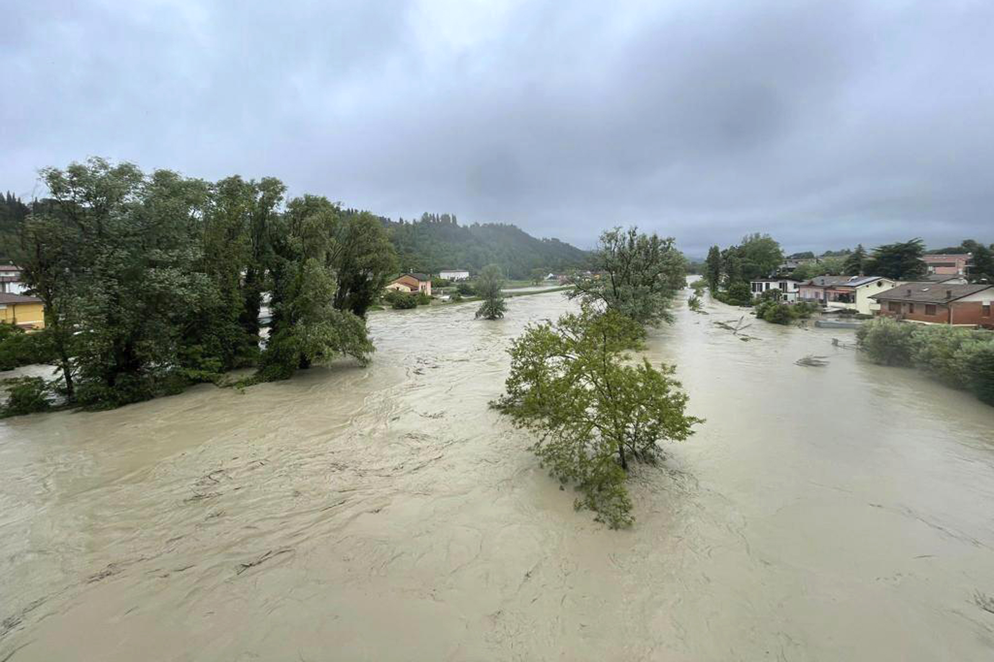 A view of an overflowing Savio river in Cesena, central Italy, Wednesday, May 17, 2023. The mayor of the city of Cesena, Enzo Lattuca, posted a video early Wednesday on Facebook to warn that continued heavy rains in the Emilia-Romagna region could again flood the Savio river and smaller tributaries. He urged residents to move to upper floors of their homes and avoid riverbanks, and announced the closure to traffic of some bridges and streets after heavy flooding sent rivers of mud sloshing through town. 