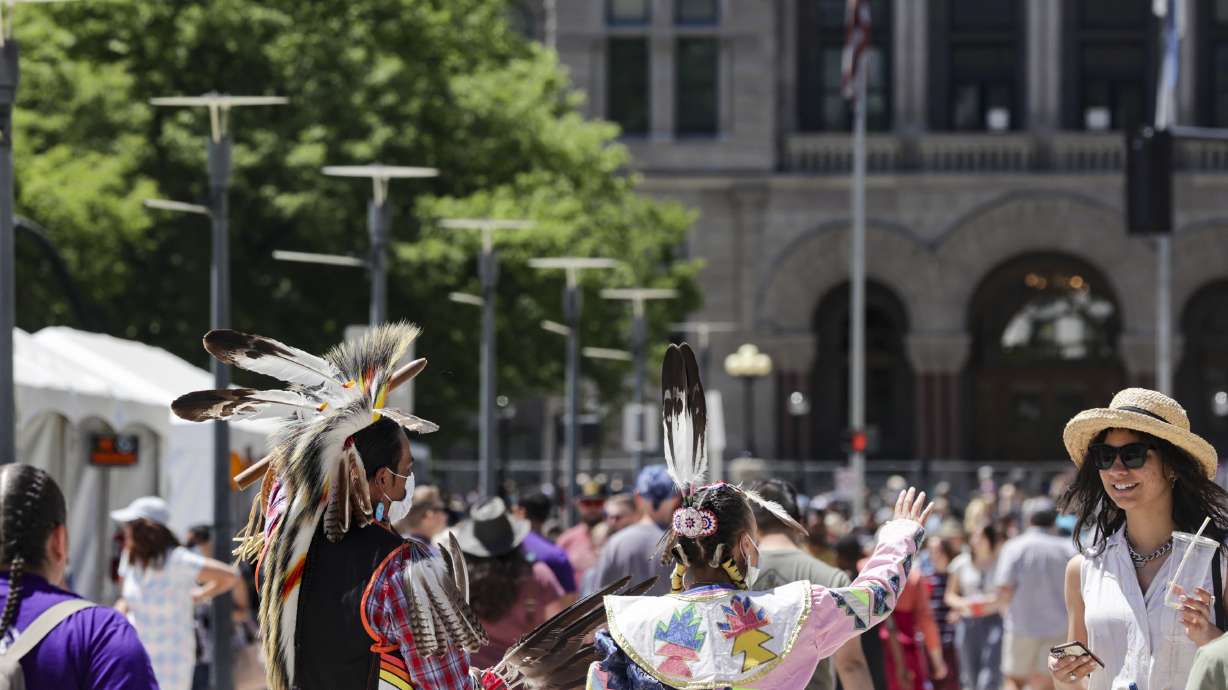 People attend the Living Traditions Festival at Washington Square Park in Salt Lake City on May 22, 2022.