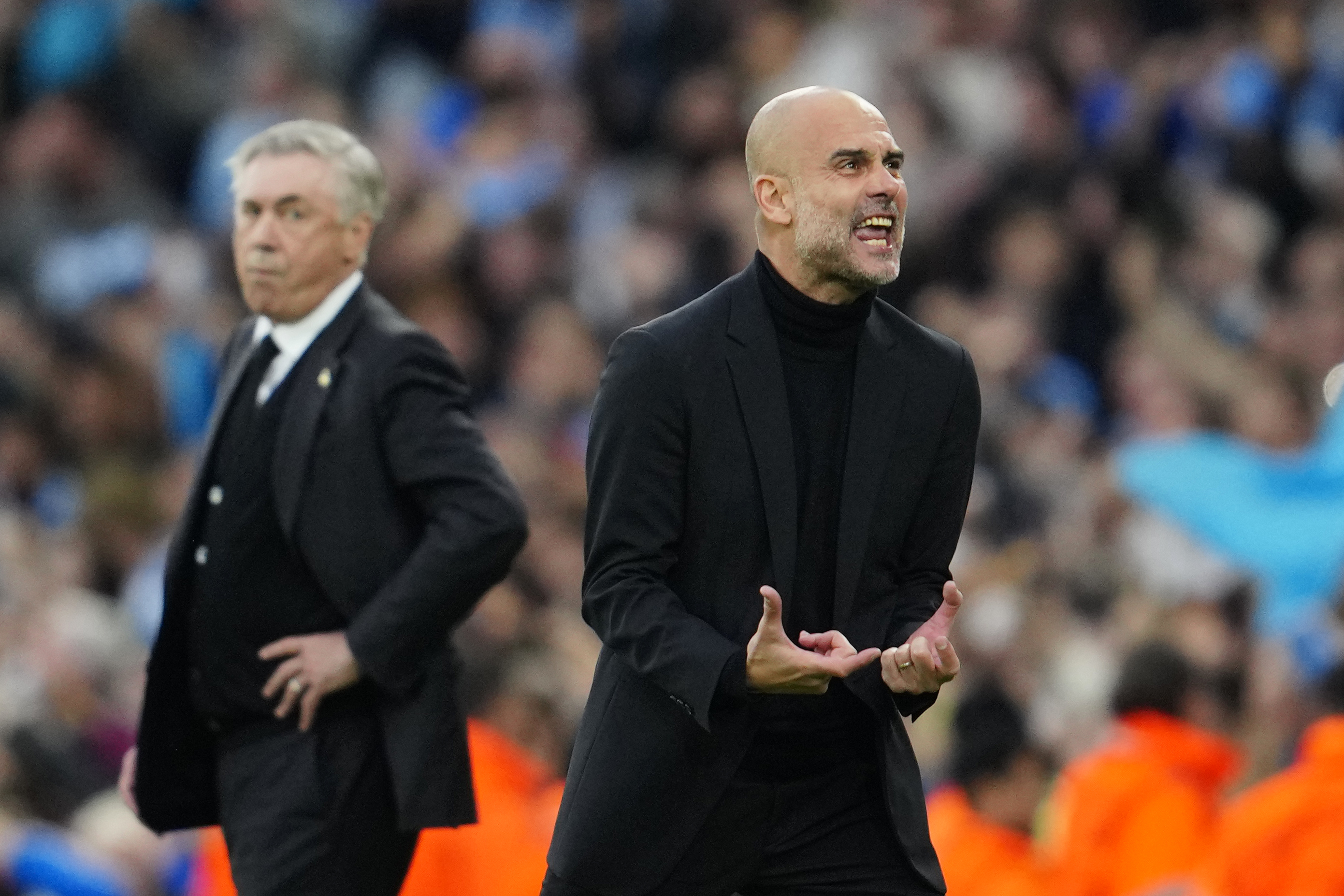 Manchester City's head coach Pep Guardiola reacts after Bernardo Silva scored the opening goal during the Champions League semifinal second leg soccer match between Manchester City and Real Madrid at Etihad stadium in Manchester, England, Wednesday, May 17, 2023. 