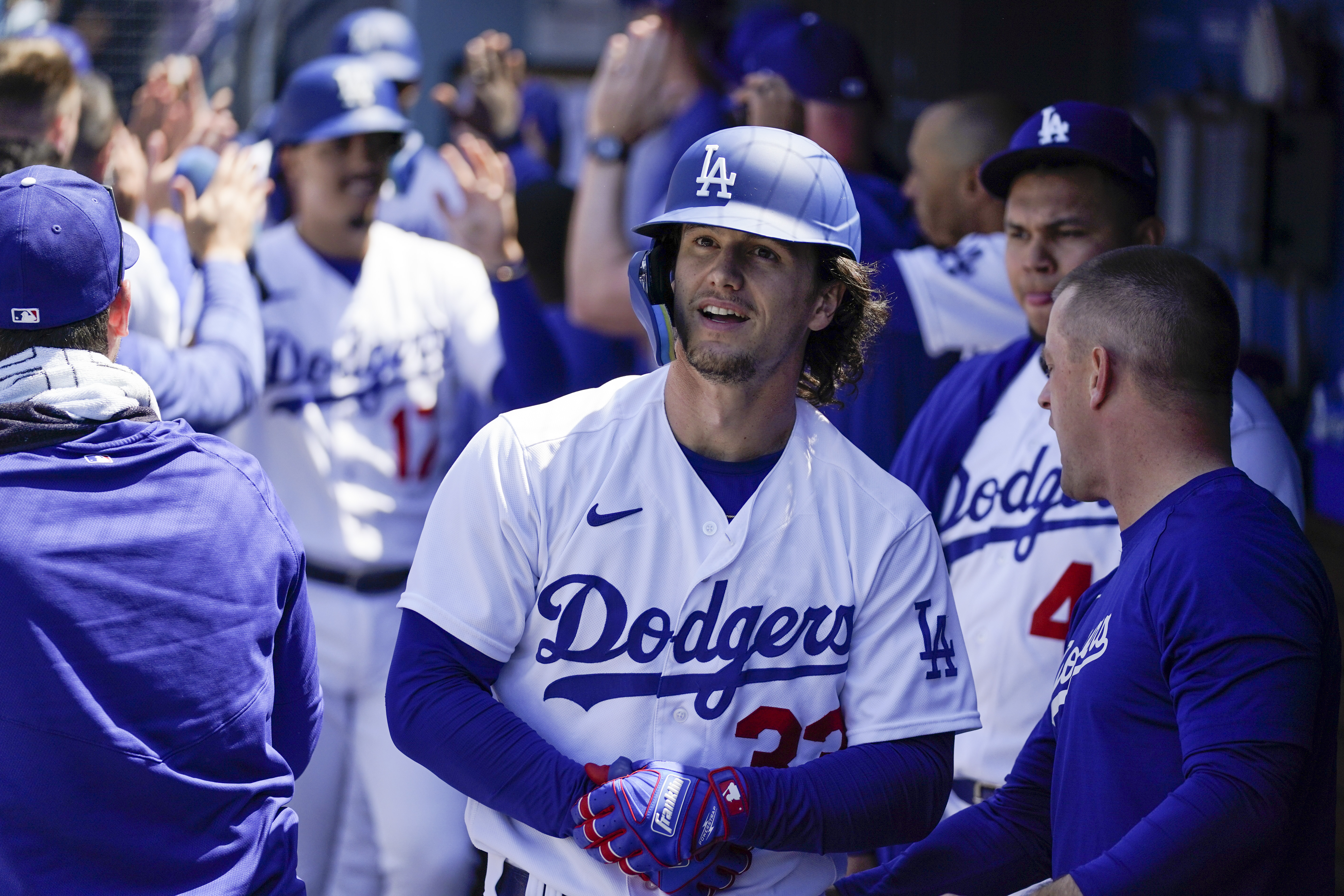Los Angeles Dodgers' James Outman, center, celebrates in the dugout after hitting a grand slam home run during the seventh inning of a baseball game against the Minnesota Twins in Los Angeles, Wednesday, May 17, 2023. Max Muncy, Jason Heyward, and Miguel Vargas also scored. 