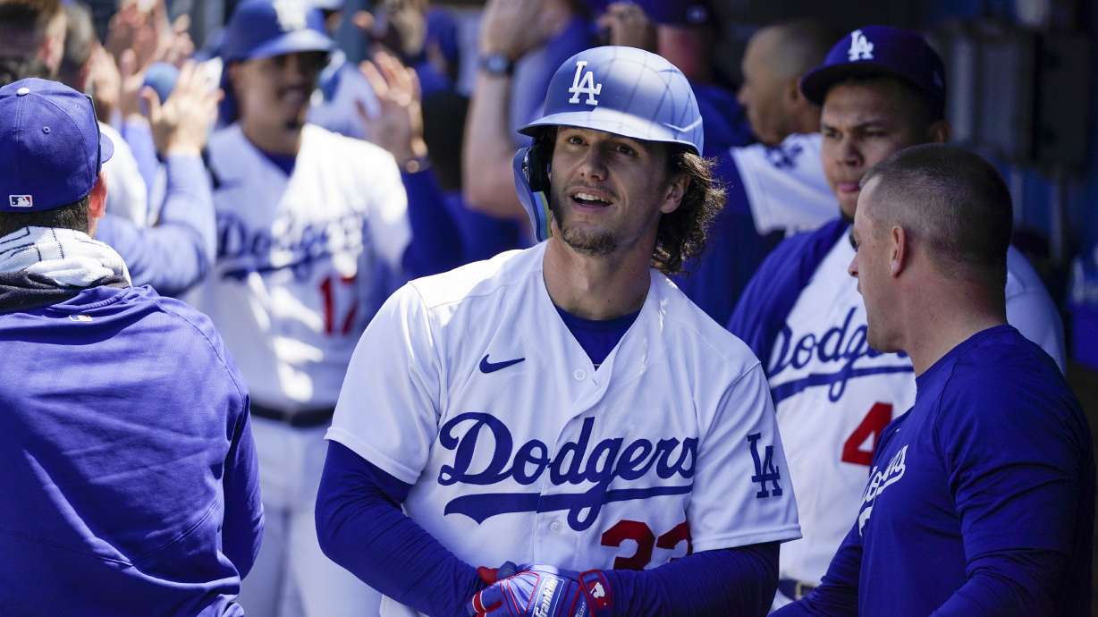 Los Angeles Dodgers' James Outman, center, celebrates in the dugout after hitting a grand slam home run during the seventh inning of a baseball game against the Minnesota Twins in Los Angeles, Wednesday, May 17, 2023. Max Muncy, Jason Heyward, and Miguel Vargas also scored.