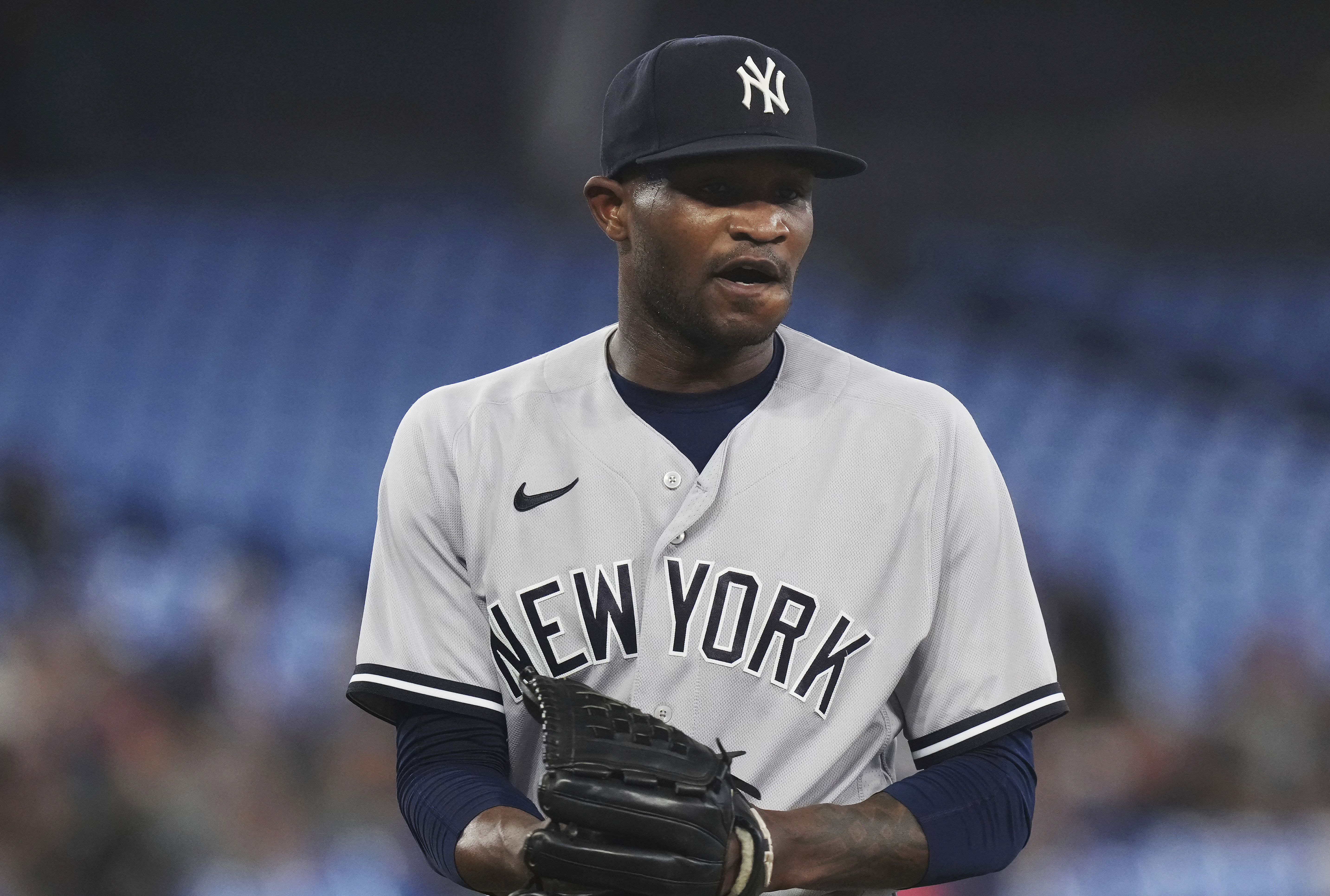 New York Yankees starting pitcher Domingo German walks off the field following the second inning of the team's baseball game against the Toronto Blue Jays on Tuesday, May 16, 2023, in Toronto. 
