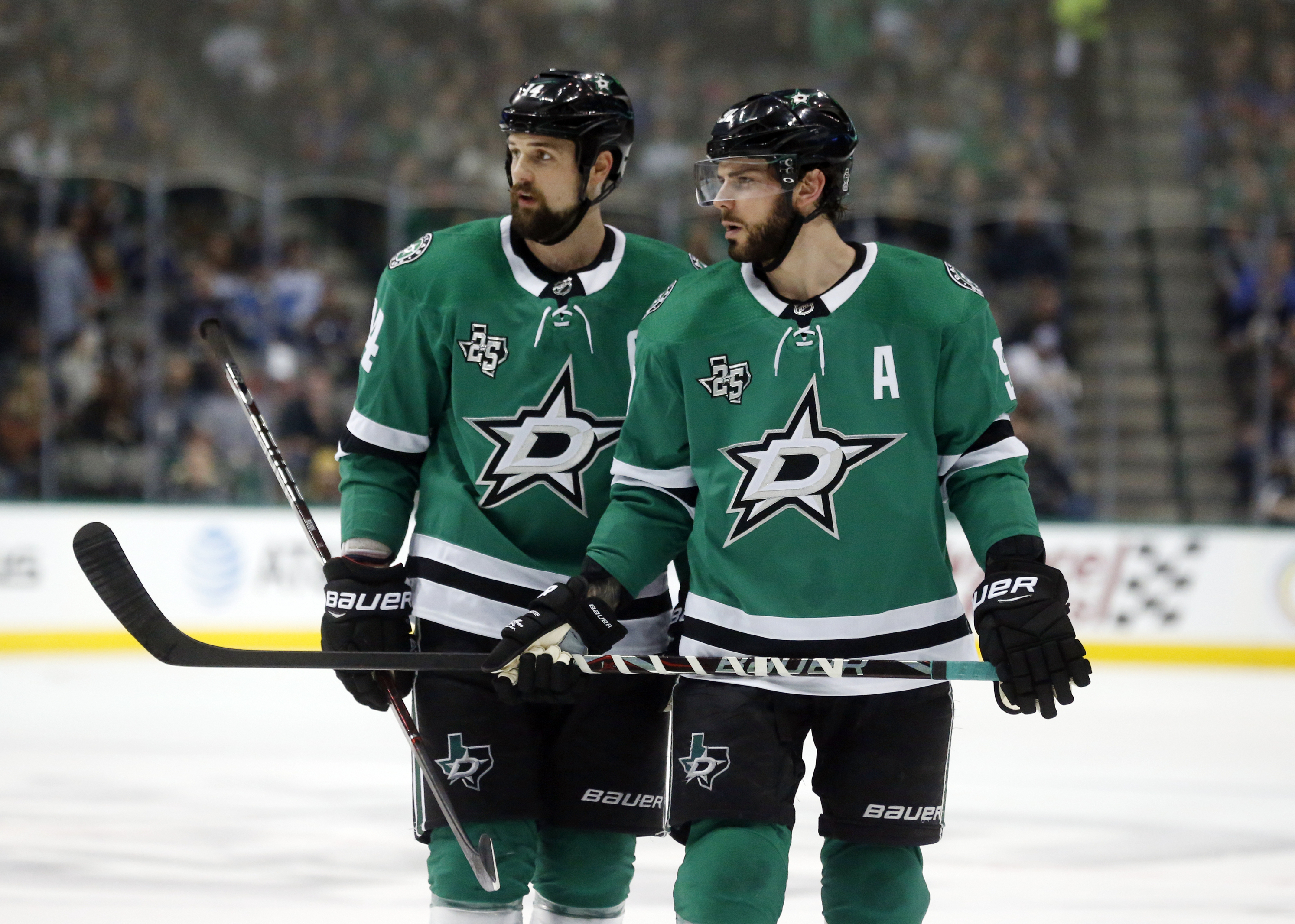 FILE - In this Friday, Dec. 29, 2017 file photo, Dallas Stars left wing Jamie Benn (14) and center Tyler Seguin (91) look over the St. Louis Blues defense during the first period of an NHL hockey game in Dallas.Jamie Benn and Tyler Seguin were regularly among the NHL's top scorers when they first started playing together in Dallas a decade ago. Now 30-something forwards, Benn the captain and six-time All-Star Seguin are far removed from skating together on the top line, or even leading their own team in scoring while having the two biggest contracts on the Stars roster.
