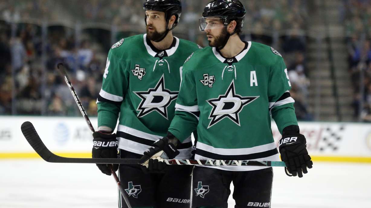 FILE - In this Friday, Dec. 29, 2017 file photo, Dallas Stars left wing Jamie Benn (14) and center Tyler Seguin (91) look over the St. Louis Blues defense during the first period of an NHL hockey game in Dallas.Jamie Benn and Tyler Seguin were regularly among the NHL's top scorers when they first started playing together in Dallas a decade ago. Now 30-something forwards, Benn the captain and six-time All-Star Seguin are far removed from skating together on the top line, or even leading their own team in scoring while having the two biggest contracts on the Stars roster.