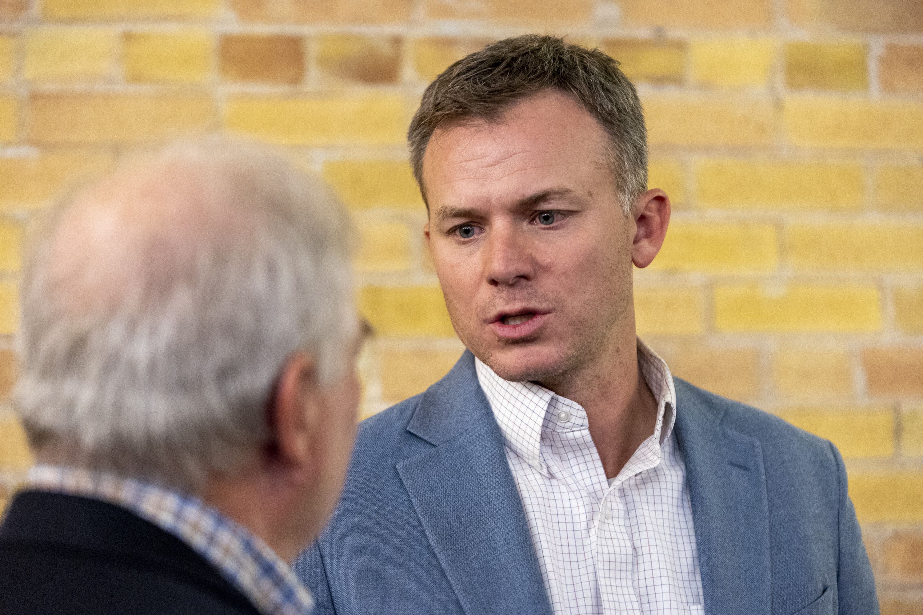 Rep. Blake Moore, the incumbent congressman for Utah’s 1st Congressional District, speaks with John Boyer of North Ogden at a Republican watch party in Ogden on Nov. 8, 2022.