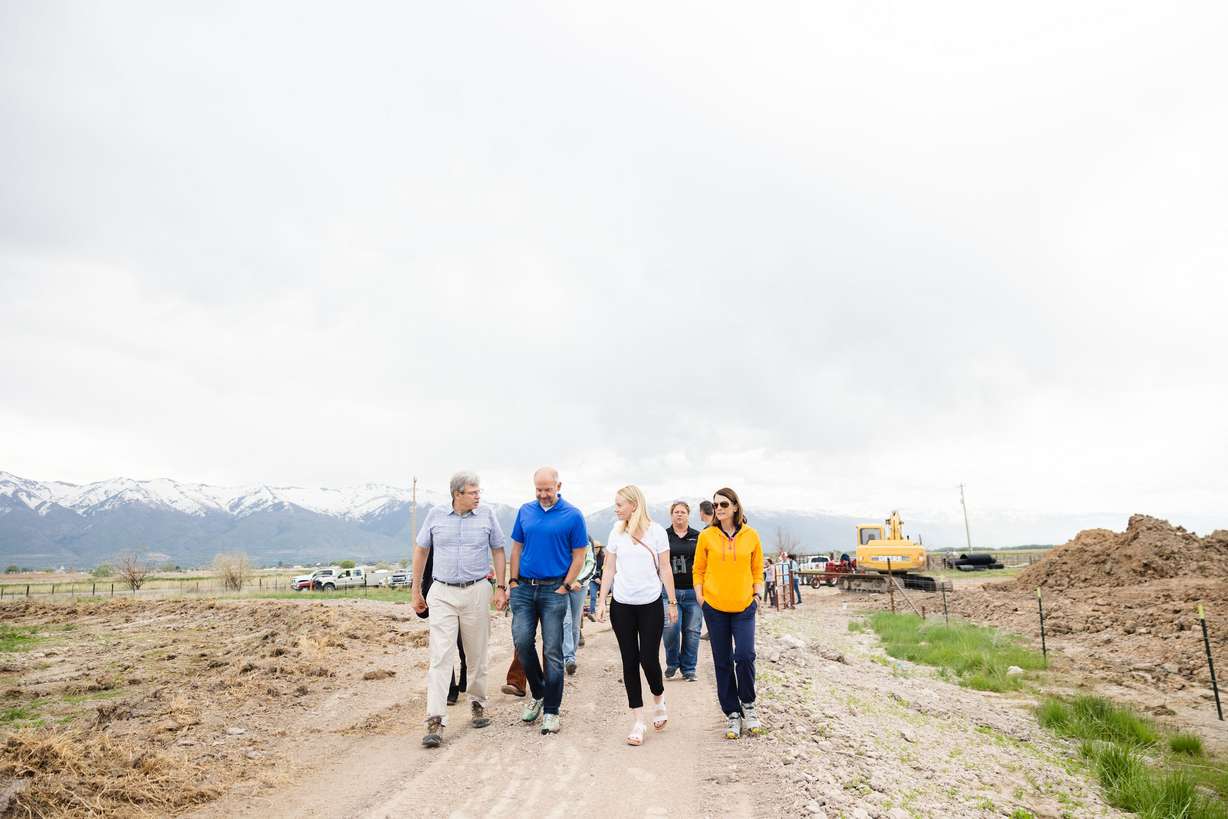 Dave Livermore, The Nature Conservancy director in Utah, left, leads a tour of the completion of the Freeport Drain project at the Great Salt Lake Shorelands Preserve in Layton on Wednesday.