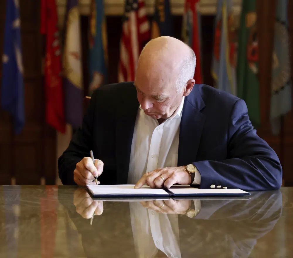 Republican Gov. Greg Gianforte signs a law banning TikTok in the state, Wednesday in Helena, Mont. That law made Montana became the first state in the U.S. to completely ban TikTok.