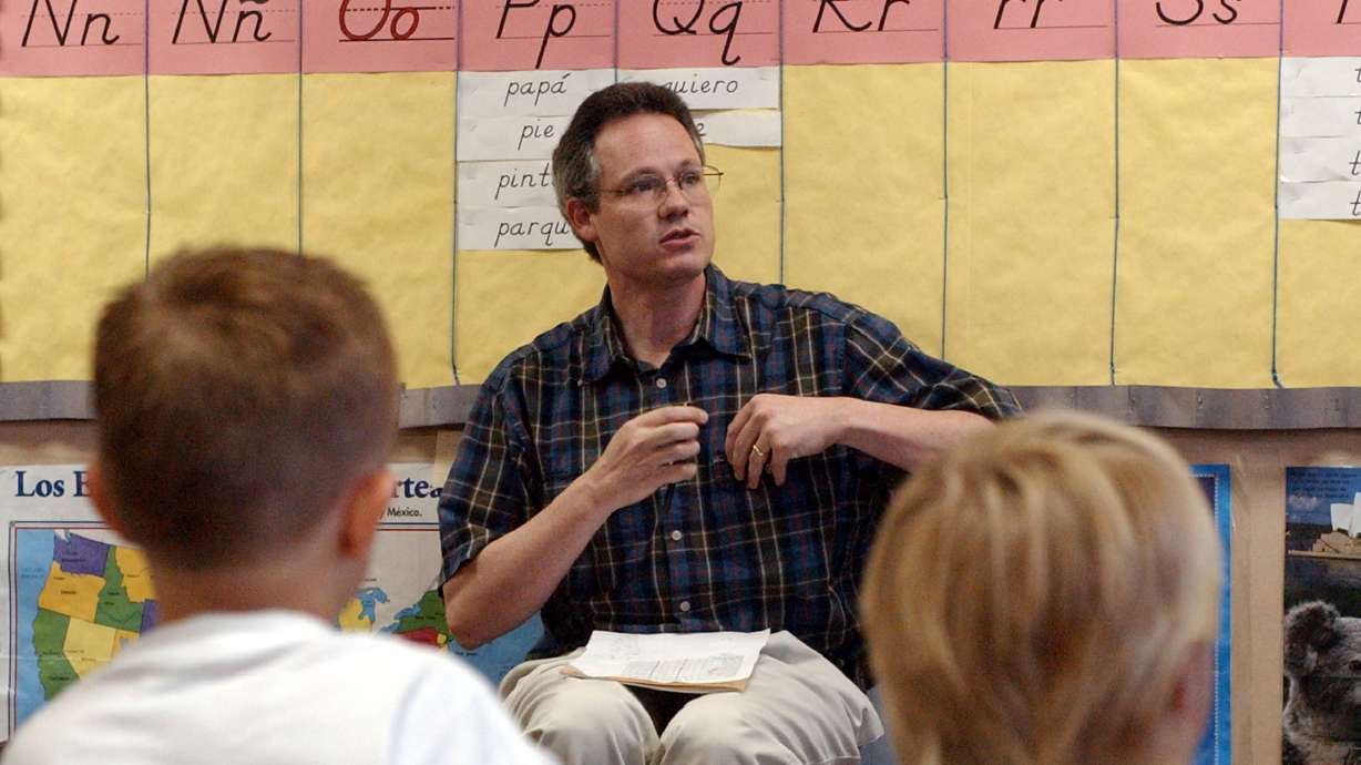 Jeff Gomm speaks with students during a summer language camp at Timpanogos Elementary in Provo on June 27, 2002. Research says that 74.3% of the country's teachers are female, while only 25.7% are male.